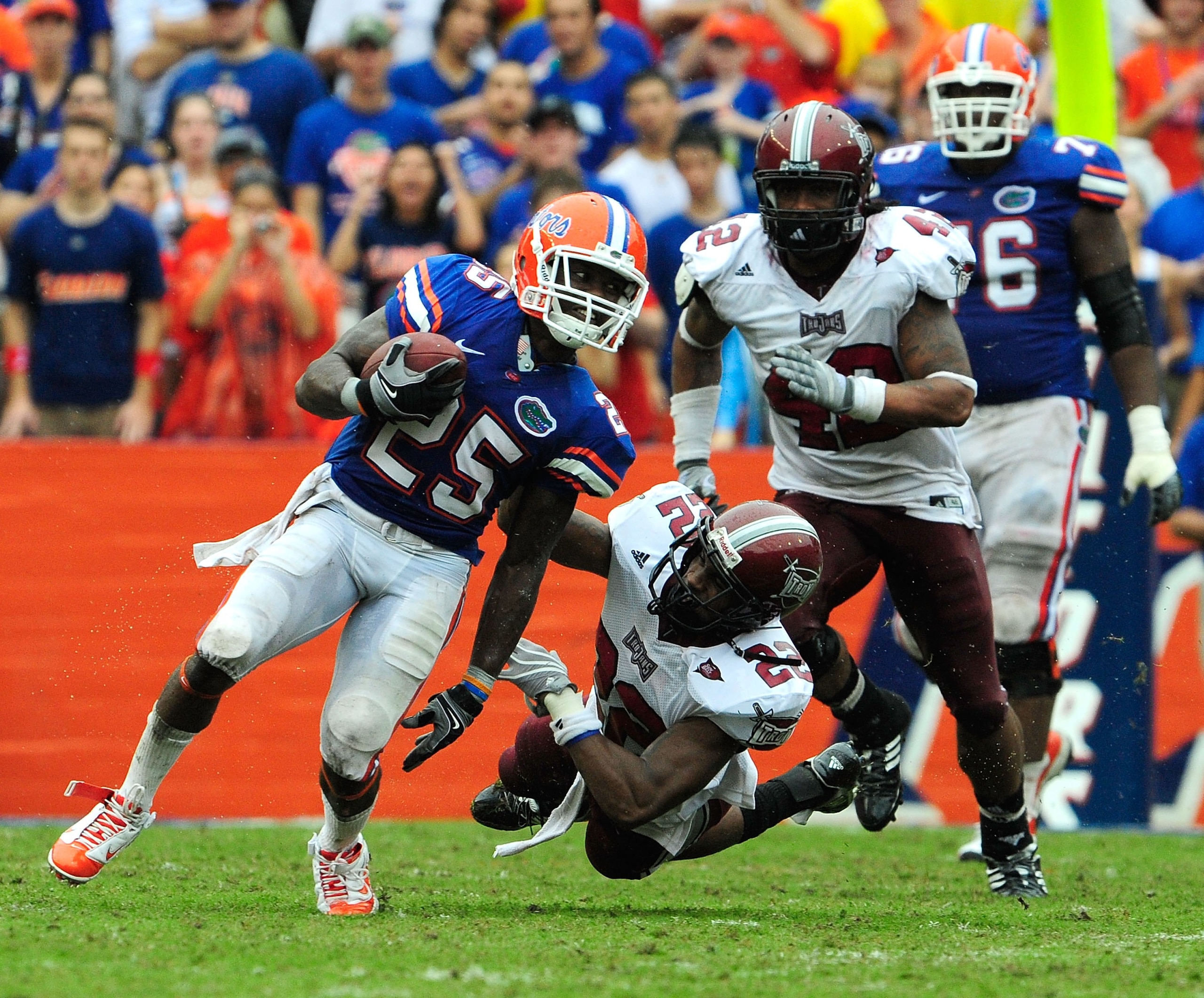 GAINESVILLE, FL - SEPTEMBER 12:  Brandon James #25 of the Florida Gators breaks the tackle of John Birmingham #22 of the Troy Trojans during the game at Ben Hill Griffin Stadium on September 12, 2009 in Gainesville, Florida.  (Photo by Sam Greenwood/Getty