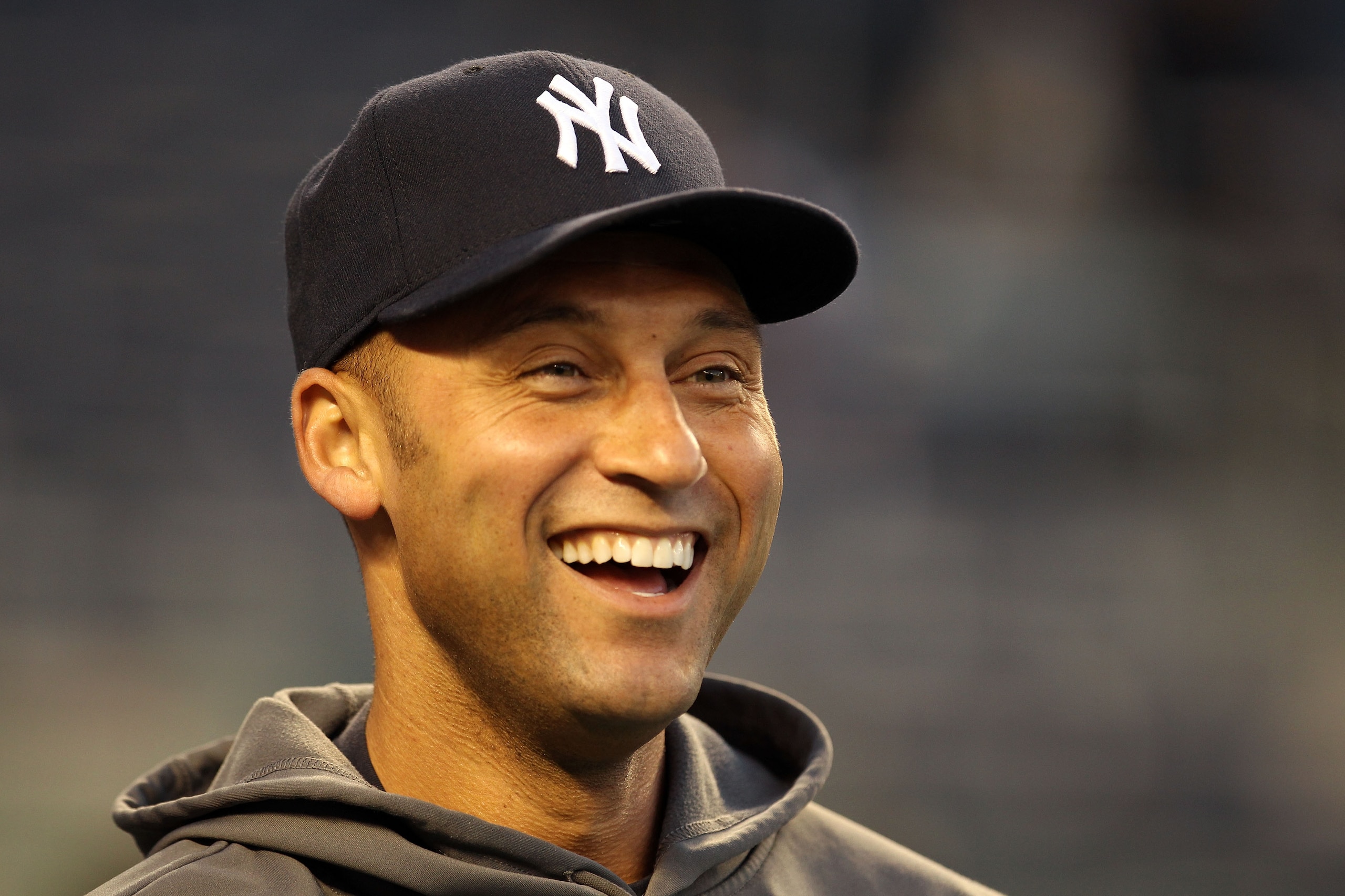NEW YORK - OCTOBER 19:  Derek Jeter #2 of the New York Yankees smiles during batting practice against the Texas Rangers in Game Four of the ALCS during the 2010 MLB Playoffs at Yankee Stadium on October 19, 2010 in the Bronx borough of New York City.  (Ph