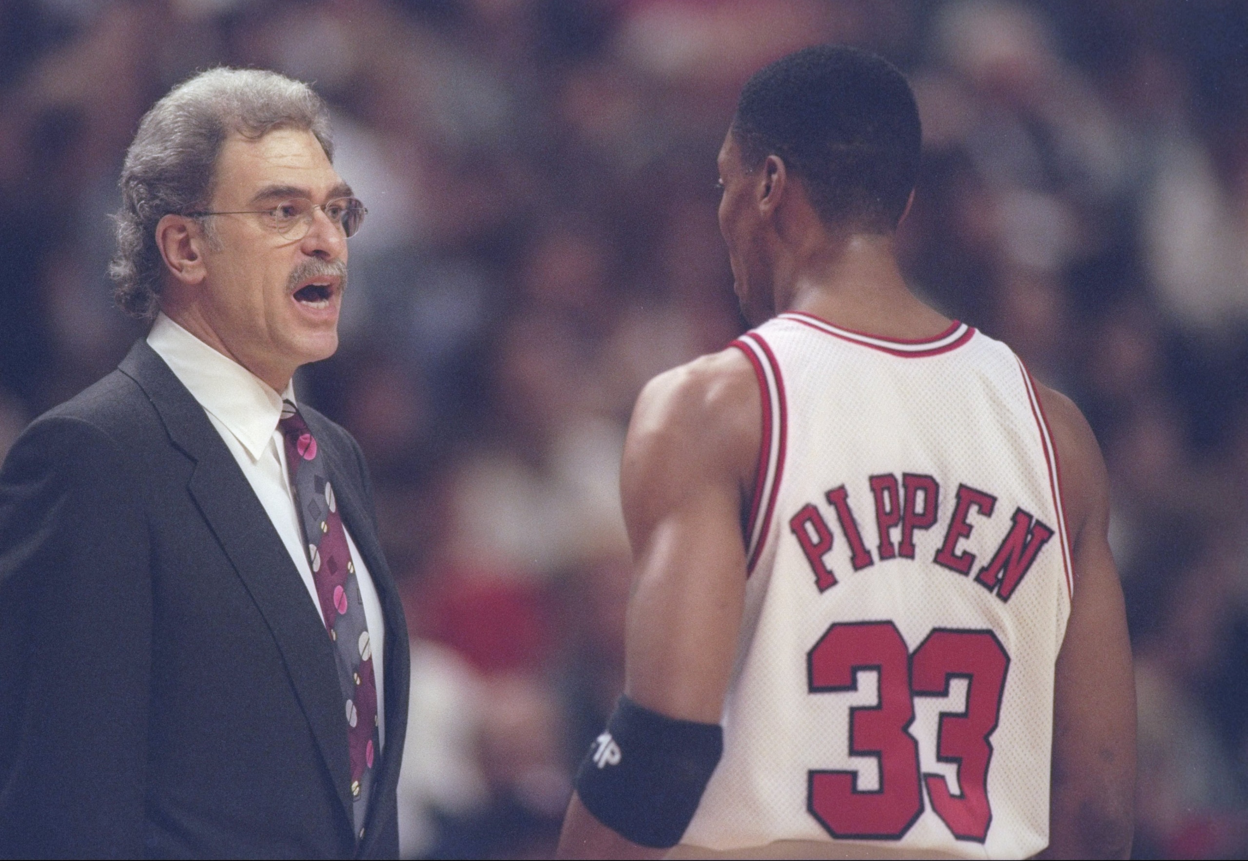 7 Mar 1997: Coach Phil Jackson and forward Scottie Pippen of the Chicago Bulls have a discussion during a game against Indiana Pacers tries to steal the pass at the United Center in Chicago, Illinois. The Bulls won the game 104 - 96. 7 Mar 1997: Coach Phil Jackson and forward Scottie Pippen of the Chicago Bulls have a discussion during a game against Indiana Pacers tries to steal the pass at the United Center in Chicago, Illinois. The Bulls won the game 104 - 96.
