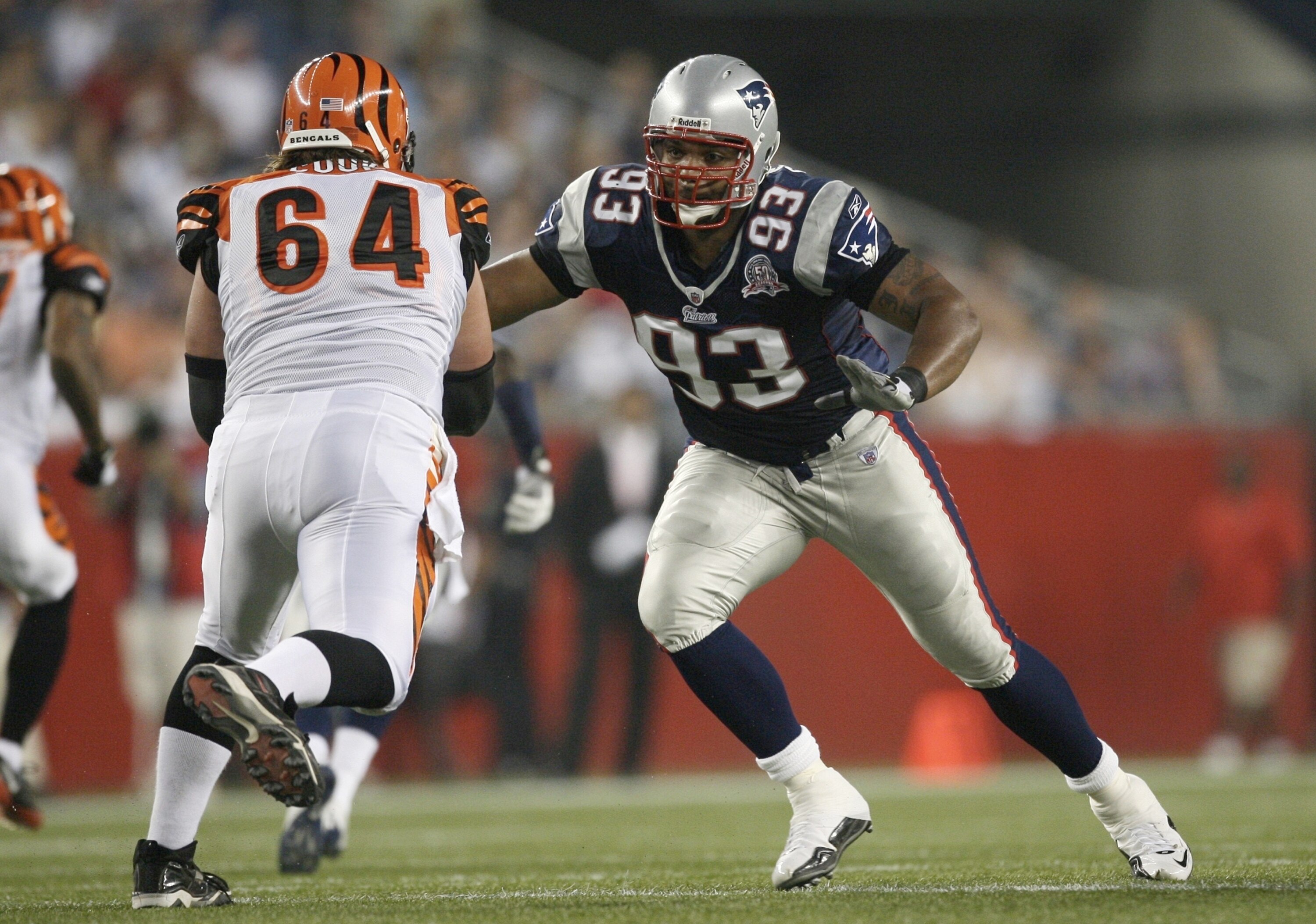 FOXBORO, MA - AUGUST 20:  Richard Seymour #93 of the New England Patriots rushes the quarterback against Kyle Cook #64 of the Cincinnati Bengals during their preseason game at Gillette Stadium on August 20, 2009 in Foxboro, Massachusetts.  (Photo by Jim R