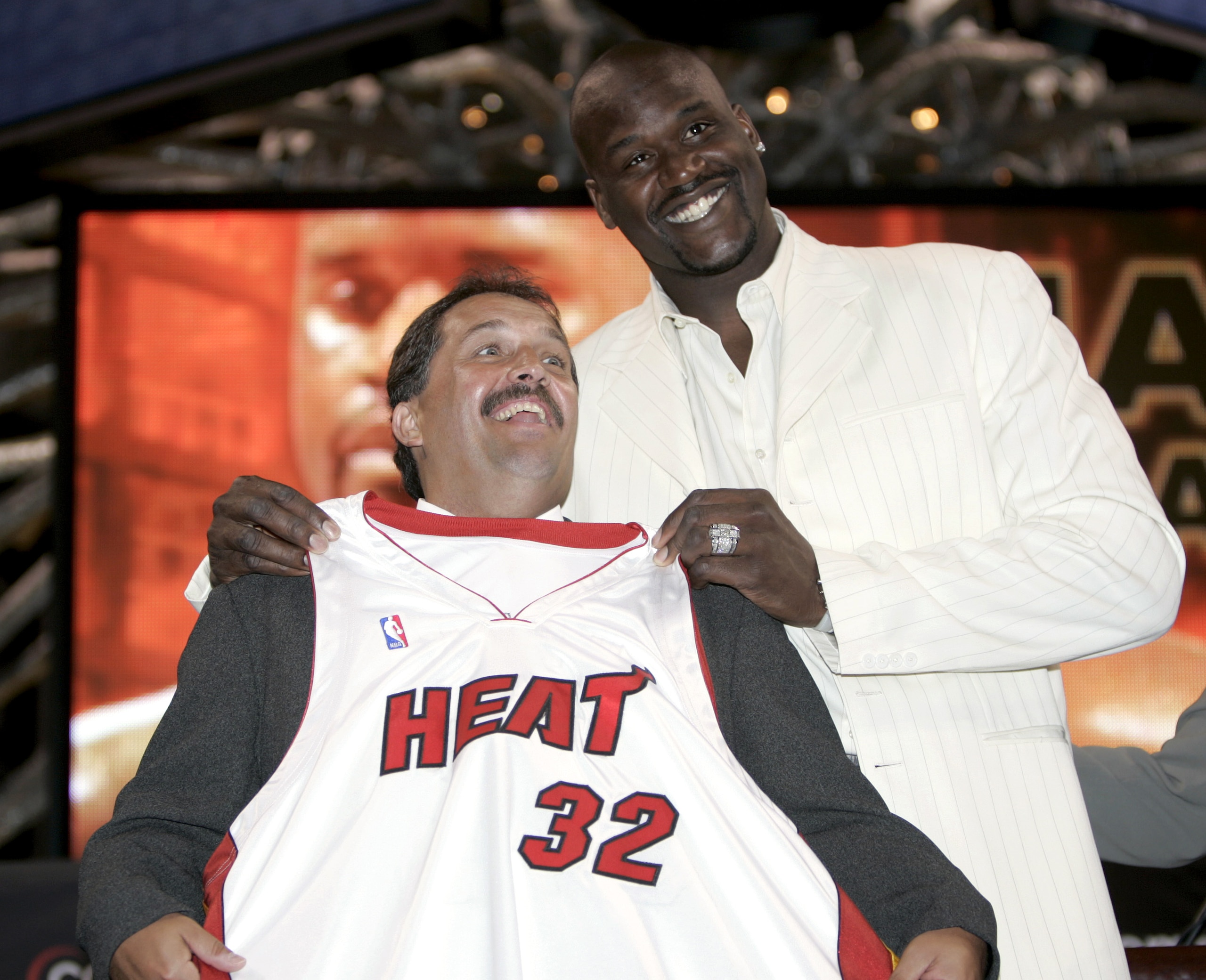 MIAMI - JULY 20: Shaquille O'Neal of the Miami Heat holds up his new #32 jersey over Coach Stan Van Gundy (L) during a press conference to offically announce his arrival to the Miami Heat July 20, 2004 at the American Airlines Arena in Miami, Florida. O' MIAMI - JULY 20: Shaquille O'Neal of the Miami Heat holds up his new #32 jersey over Coach Stan Van Gundy (L) during a press conference to offically announce his arrival to the Miami Heat July 20, 2004 at the American Airlines Arena in Miami, Florida. O'