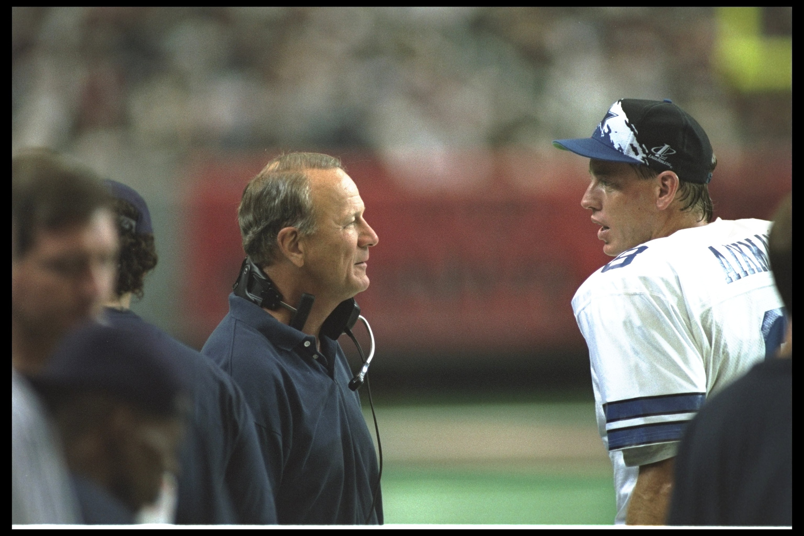 29 Oct 1995: Dallas Cowboys quarterback Troy Aikman and head coach Barry Switzer confer during a game against the Atlanta Falcons at the Georgia Dome in Atlanta, Georgia. The Cowboys won the game, 28-13. 29 Oct 1995: Dallas Cowboys quarterback Troy Aikman and head coach Barry Switzer confer during a game against the Atlanta Falcons at the Georgia Dome in Atlanta, Georgia. The Cowboys won the game, 28-13.