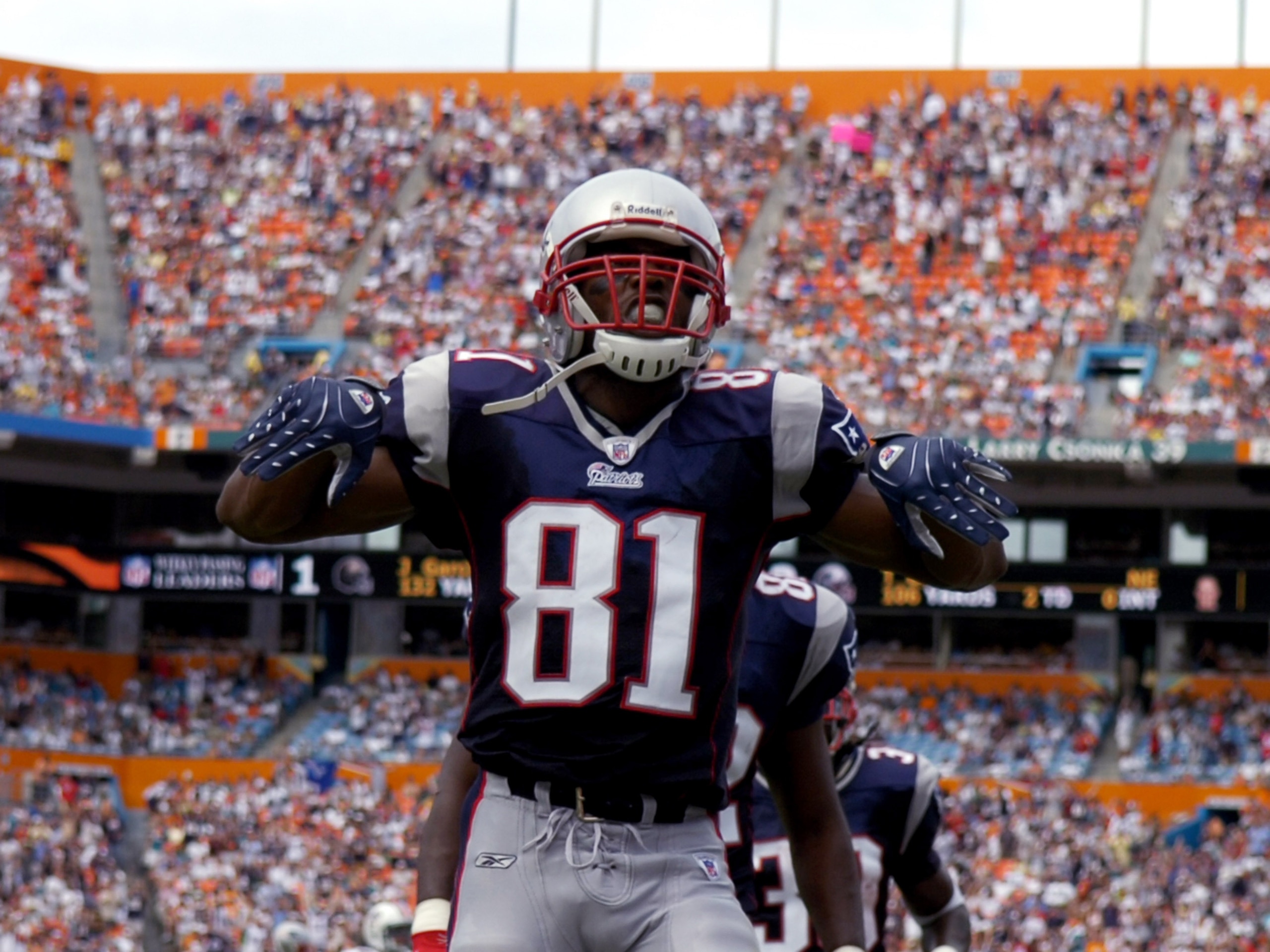 MIAMI, FL - OCTOBER 21: Wide receiver Randy Moss #81 of the New England Patriots celebrates a touchdown against the Miami Dolphins October 21, 2007 at Dolphin Stadium in Miami, Florida. (Photo by Al Messerschmidt/Getty Images)