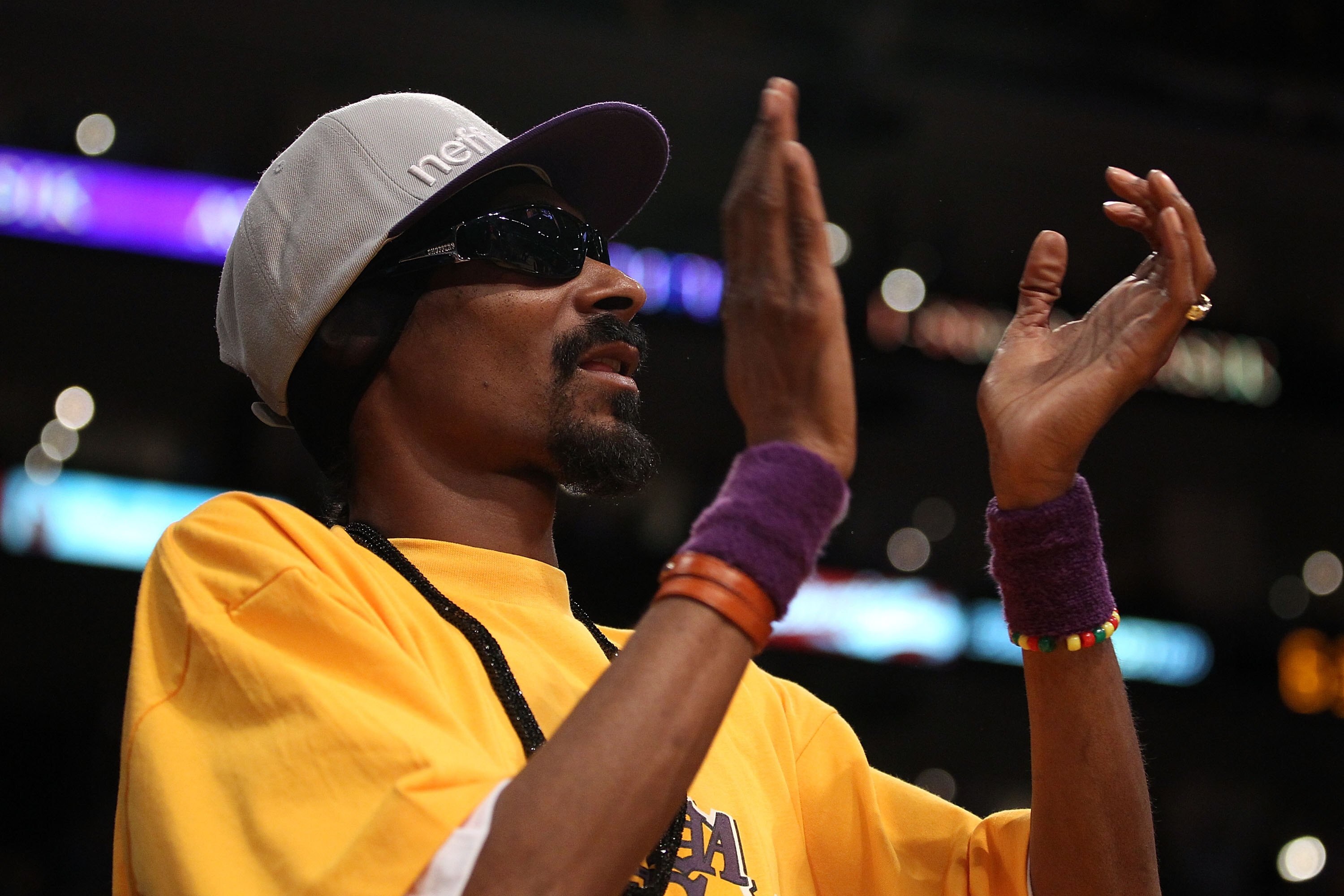 LOS ANGELES, CA - JUNE 15:  Rapper Snoop Dogg sits courtside in Game Six of the 2010 NBA Finals between the Boston Celtics and the Los Angeles Lakers at Staples Center on June 15, 2010 in Los Angeles, California.  NOTE TO USER: User expressly acknowledges