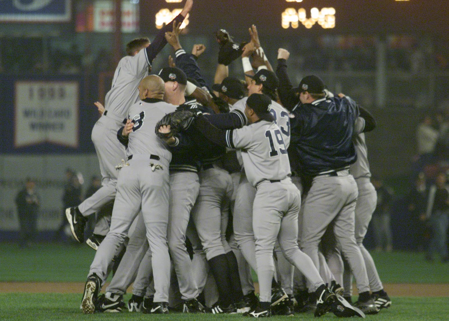 26 Oct 2000:  The New York Yankees celebrates their 4-2 win and World Series Championship over the New York Mets during Game 5 of the World Series at Shea Stadium in Flushing, New York. <DIGITAL IMAGE> Mandatory Credit: Jed Jacobsohn/ALLSPORT
