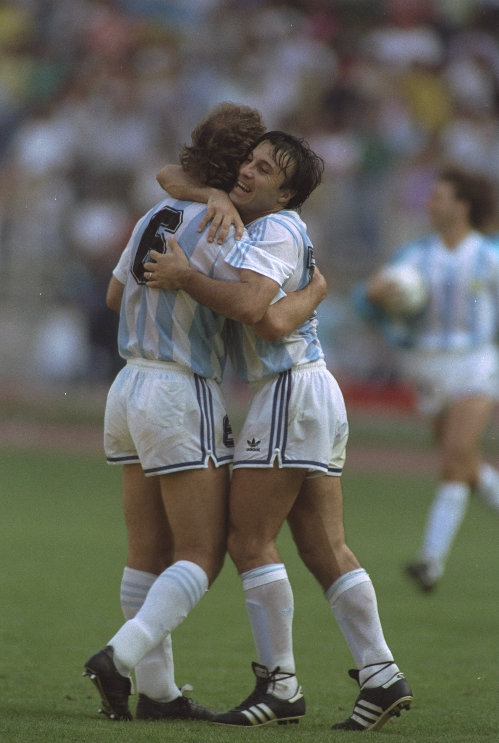 24 Jun 1990:  Jorge Olarticoehea (left) and Gabriel Calderon (right) both of Argentina hug in celebration after their win against Brazil in the World Cup match in Turin, Italy. Argentina won the match 1-0. \ Mandatory Credit: Simon  Bruty/Allsport