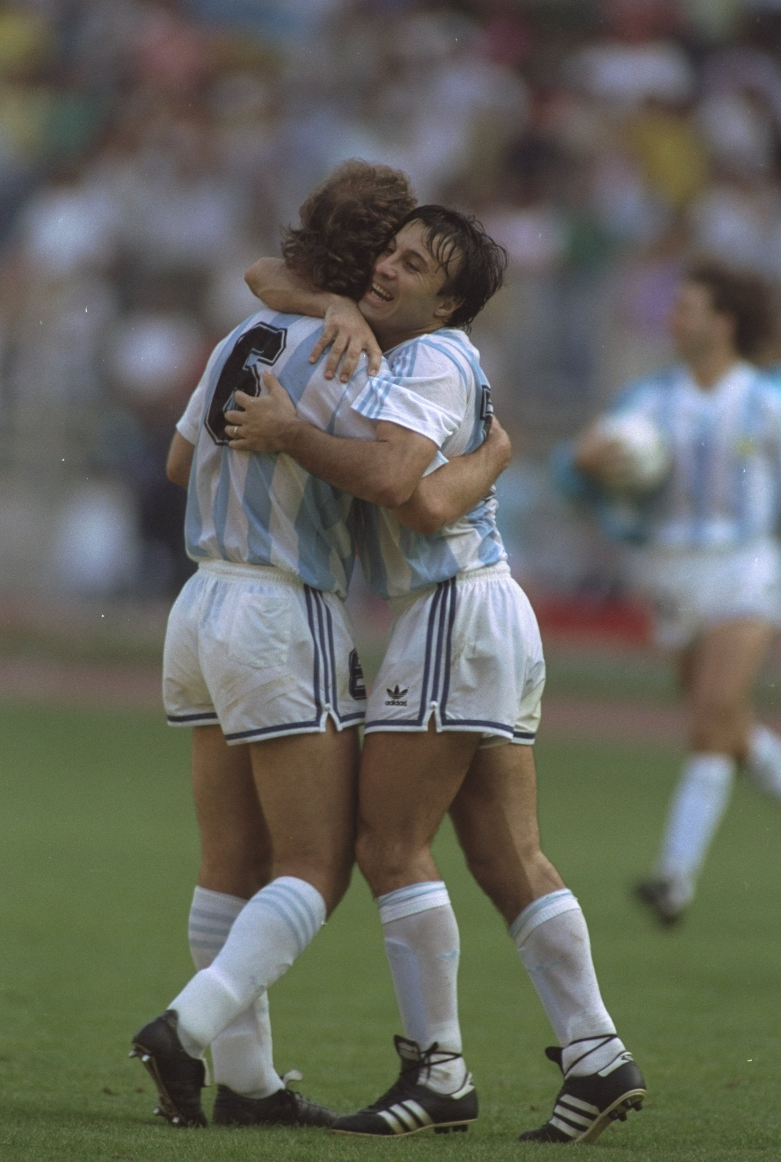 24 Jun 1990:  Jorge Olarticoehea (left) and Gabriel Calderon (right) both of Argentina hug in celebration after their win against Brazil in the World Cup match in Turin, Italy. Argentina won the match 1-0. \ Mandatory Credit: Simon  Bruty/Allsport