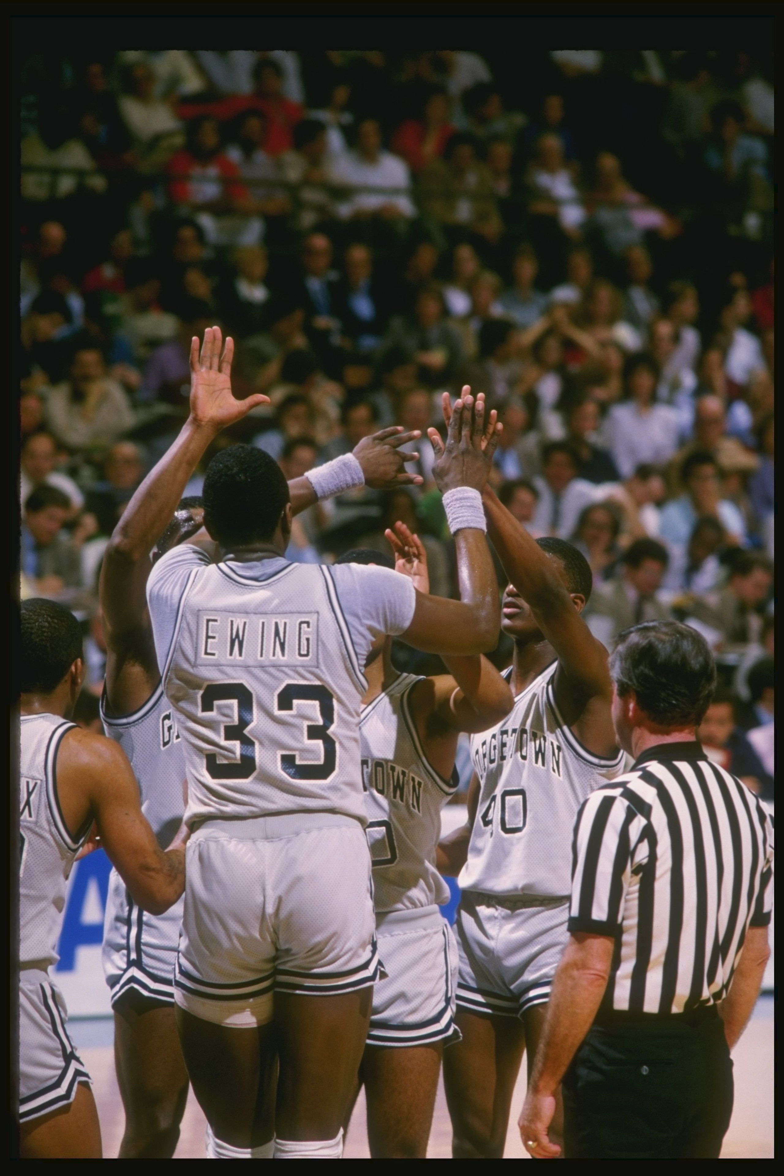 1984:  Center Patrick Ewing of the Georgetown Hoyas high fives his teammates during a game. Mandatory Credit: Allsport  /Allsport