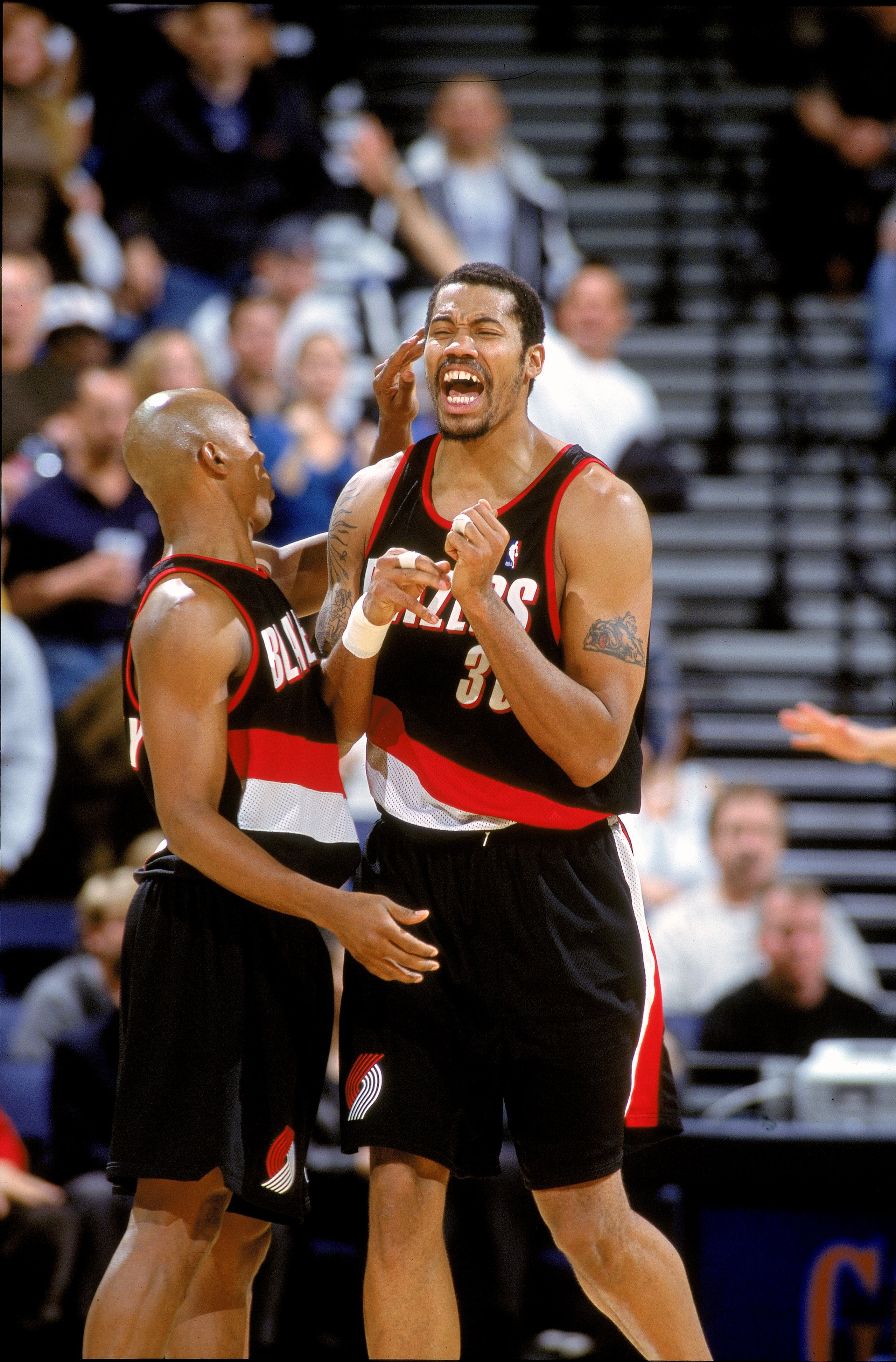 12 Dec 2000:  Rasheed Wallace #30 of the Portland Trail Blazers reacts to the play with Greg Anthony #50 during the game against the Golden State Warriors at The Arena of Oakland in California. The Trail Blazers defeated the Warriors 101-92.    NOTE TO US
