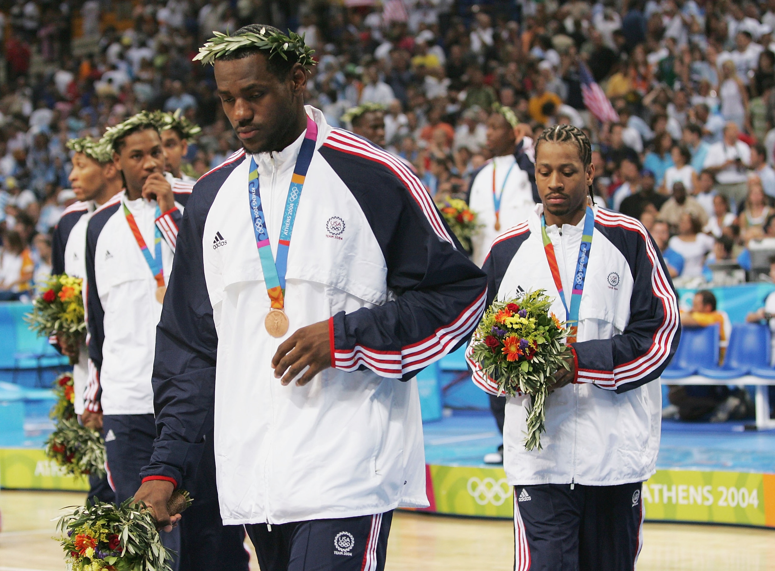 ATHENS - AUGUST 28:  LeBron James #9, Carmelo Anthony #8 and Allen Iverson of the United States walk off the court after they receive the bronze medal for men's basketball during ceremonies on August 28, 2004 during the Athens 2004 Summer Olympic Games at