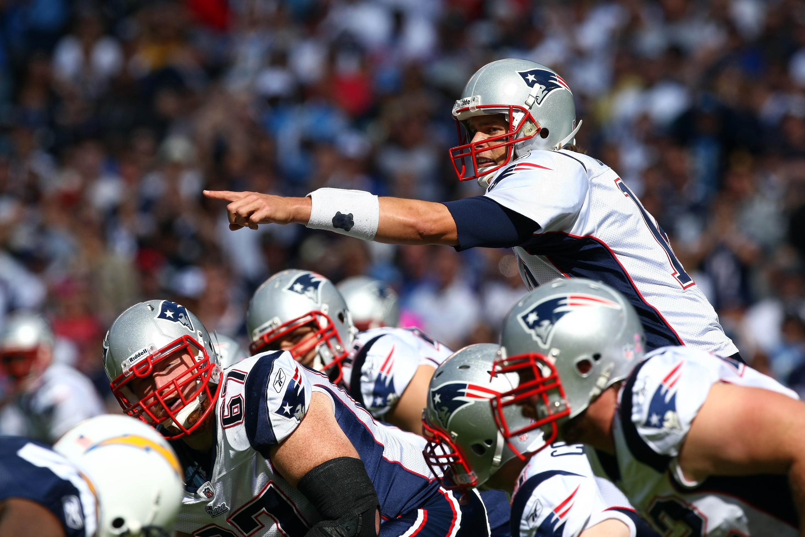 SAN DIEGO - OCTOBER 24:  Quarterback Tom Brady #12 of the New England points at the defense at the line of scrimmage against the San Diego Chargers during their NFL game on October 24, 2010 at Qualcomm Stadium in San Diego, California. (Photo by Donald Mi