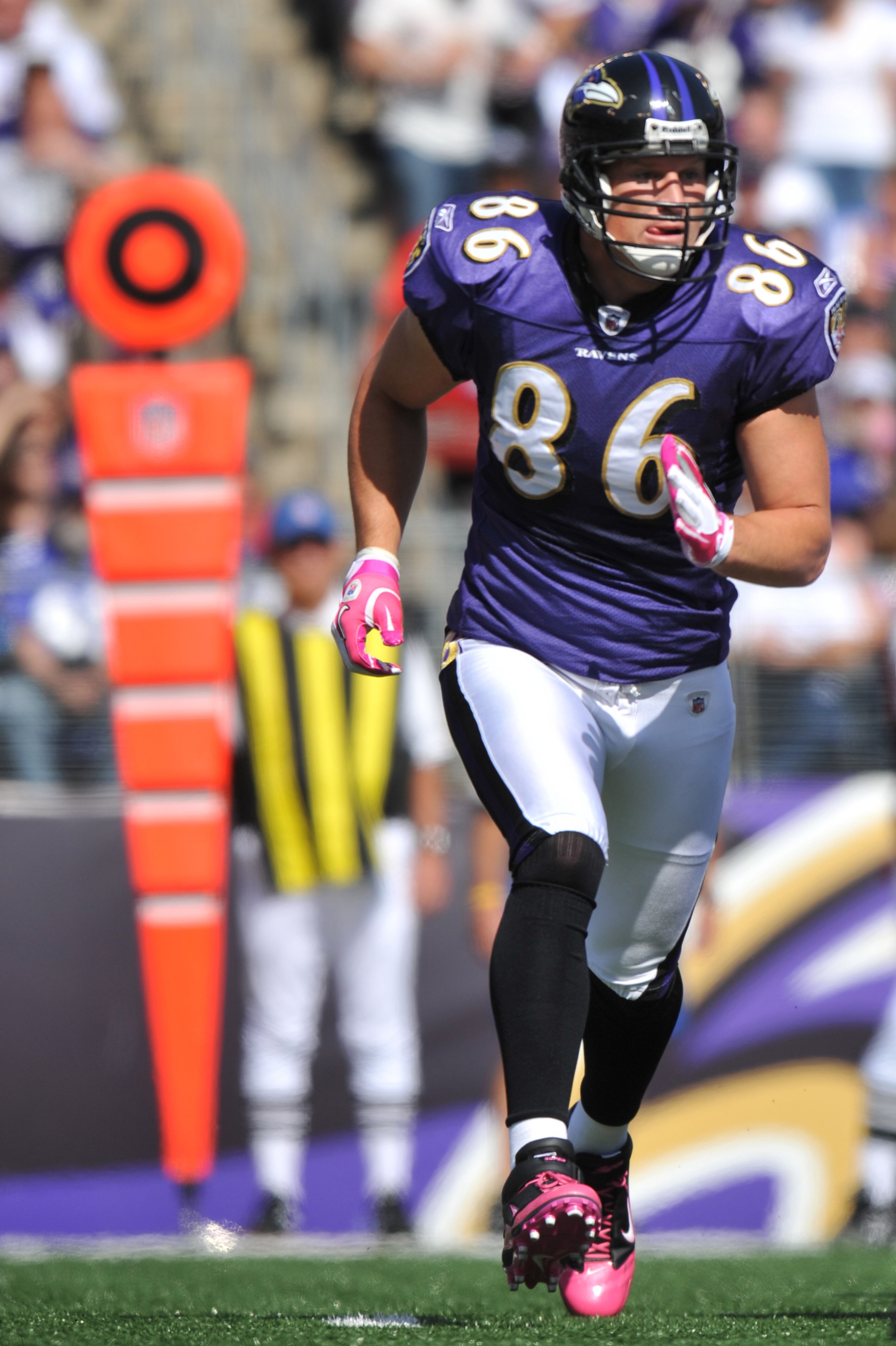 BALTIMORE, MD - OCTOBER 10: Todd Heap #86 of the Baltimore Ravens runs in the backfield during the game against the Denver Broncos at M&T Bank Stadium on October 10, 2010 in Baltimore, Maryland. Players wore pink in recognition of Breast Cancer Awareness