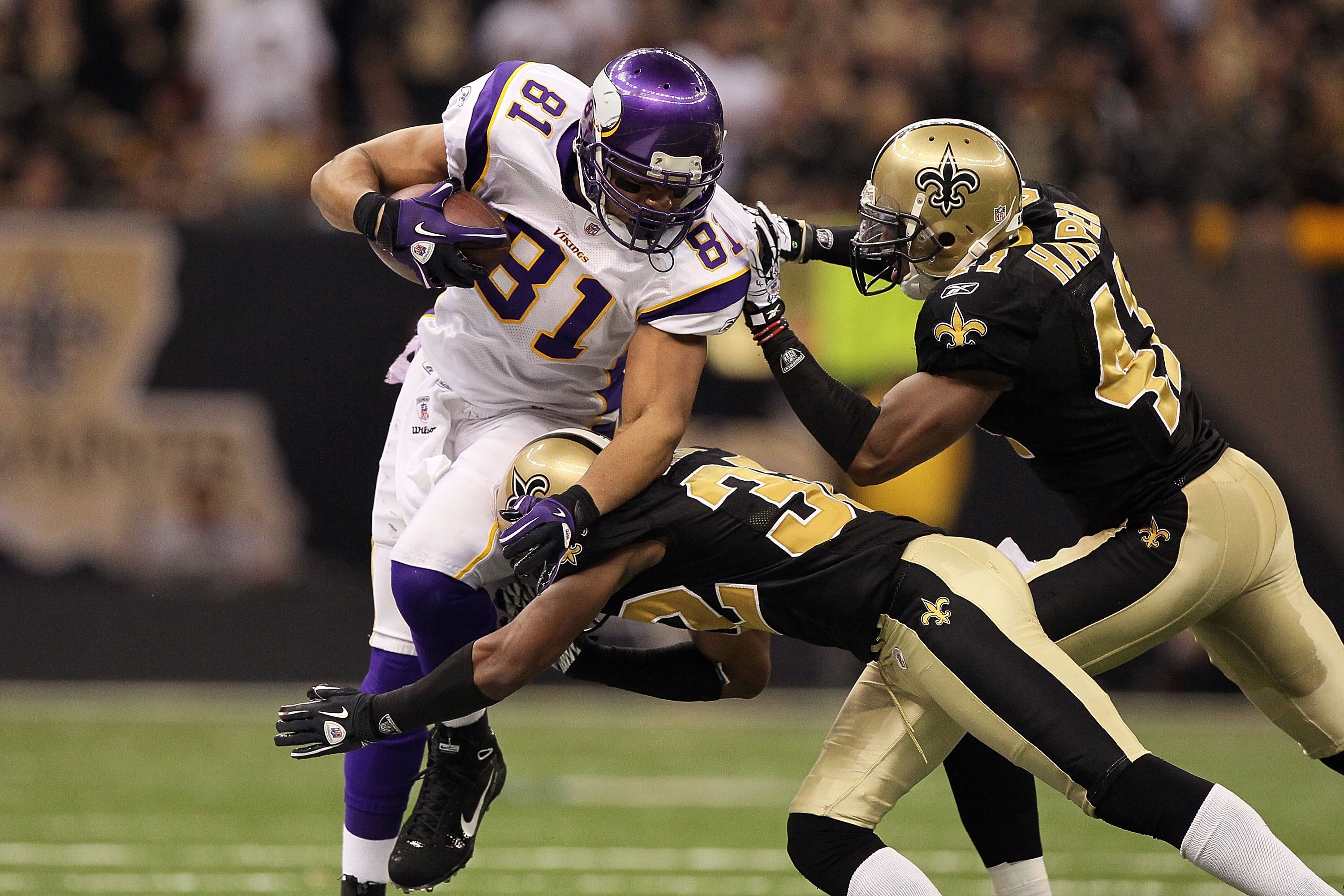 NEW ORLEANS - JANUARY 24:  Visanthe Shiancoe #81 of the Minnesota Vikings runs for yards after the catch against Jabari Greer #32 and Roman Harper #41 of the New Orleans Saints during the NFC Championship Game at the Louisiana Superdome on January 24, 201