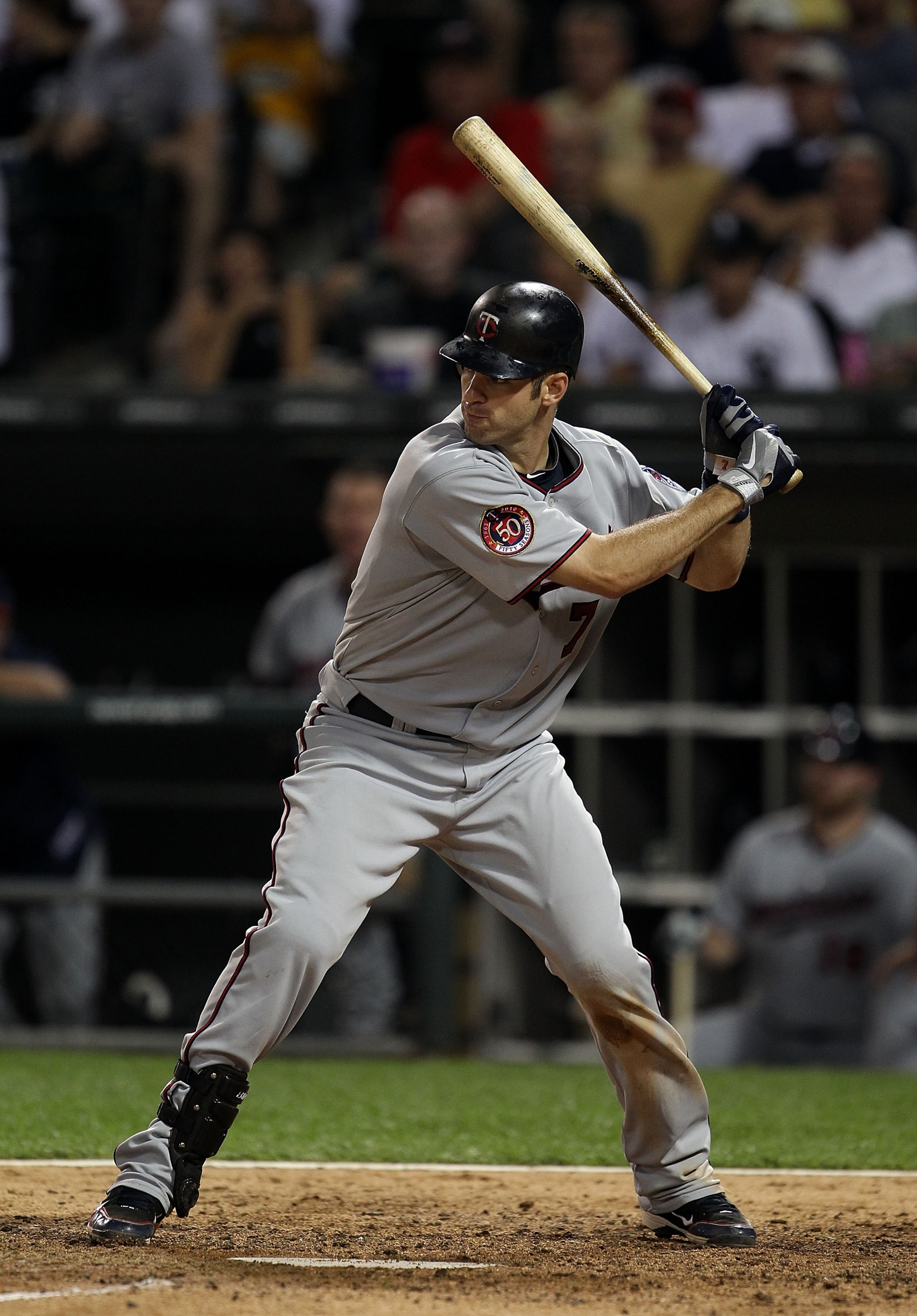 CHICAGO - AUGUST 10: Joe Mauer #7 of the Minnesota Twins prepares to bat against the Chicago White Sox at U.S. Cellular Field on August 10, 2010 in Chicago, Illinois. The Twins defeated the White Sox 12-6. (Photo by Jonathan Daniel/Getty Images)