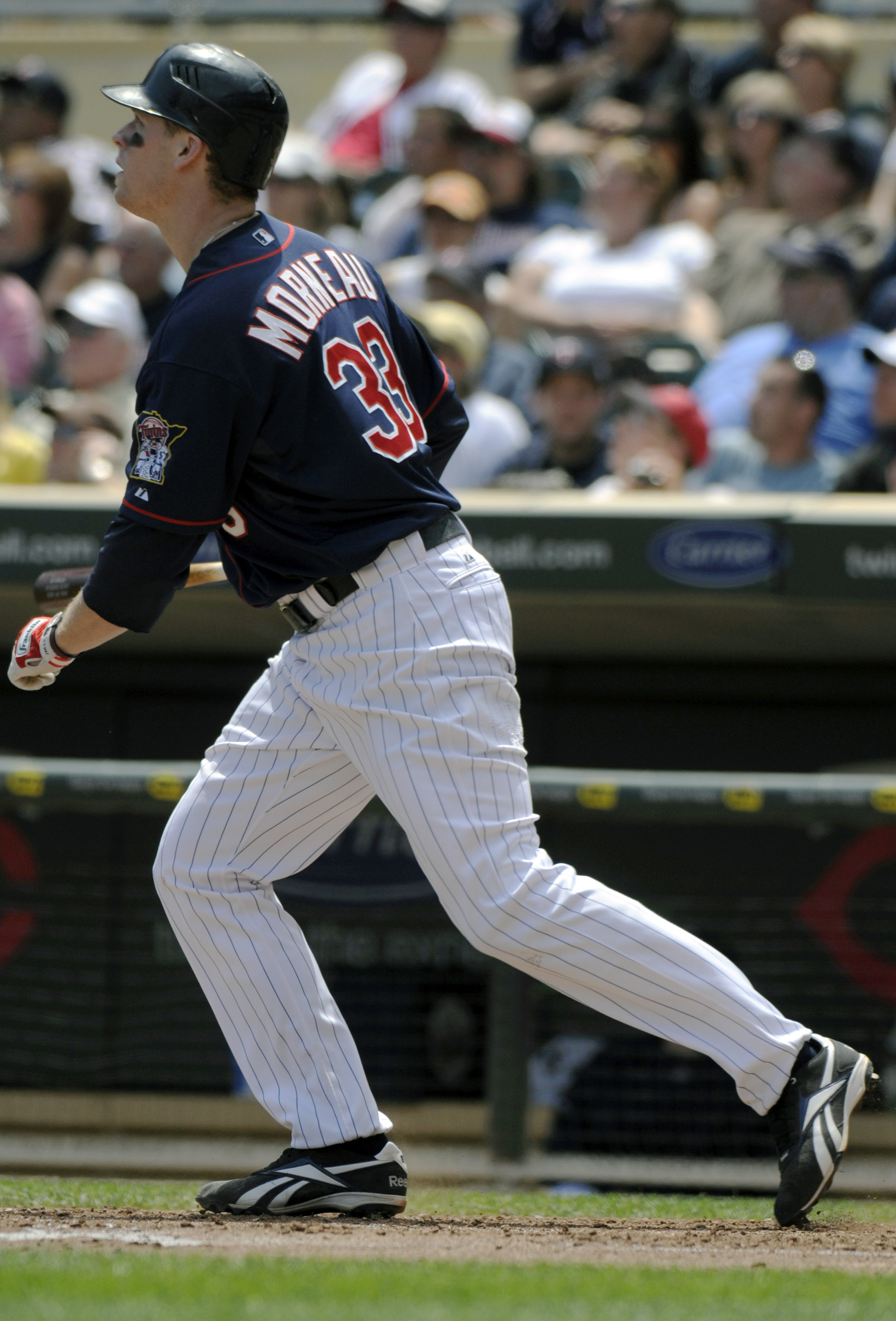 MINNEAPOLIS, MN - JUNE 30: Justin Morneau #33 of the Minnesota Twins watches the flight of his solo home run in the sixth inning against the Detroit Tigers during their game on June 30, 2010 at Target Field in Minneapolis, Minnesota. (Photo by Hannah Fosl MINNEAPOLIS, MN - JUNE 30: Justin Morneau #33 of the Minnesota Twins watches the flight of his solo home run in the sixth inning against the Detroit Tigers during their game on June 30, 2010 at Target Field in Minneapolis, Minnesota. (Photo by Hannah Fosl