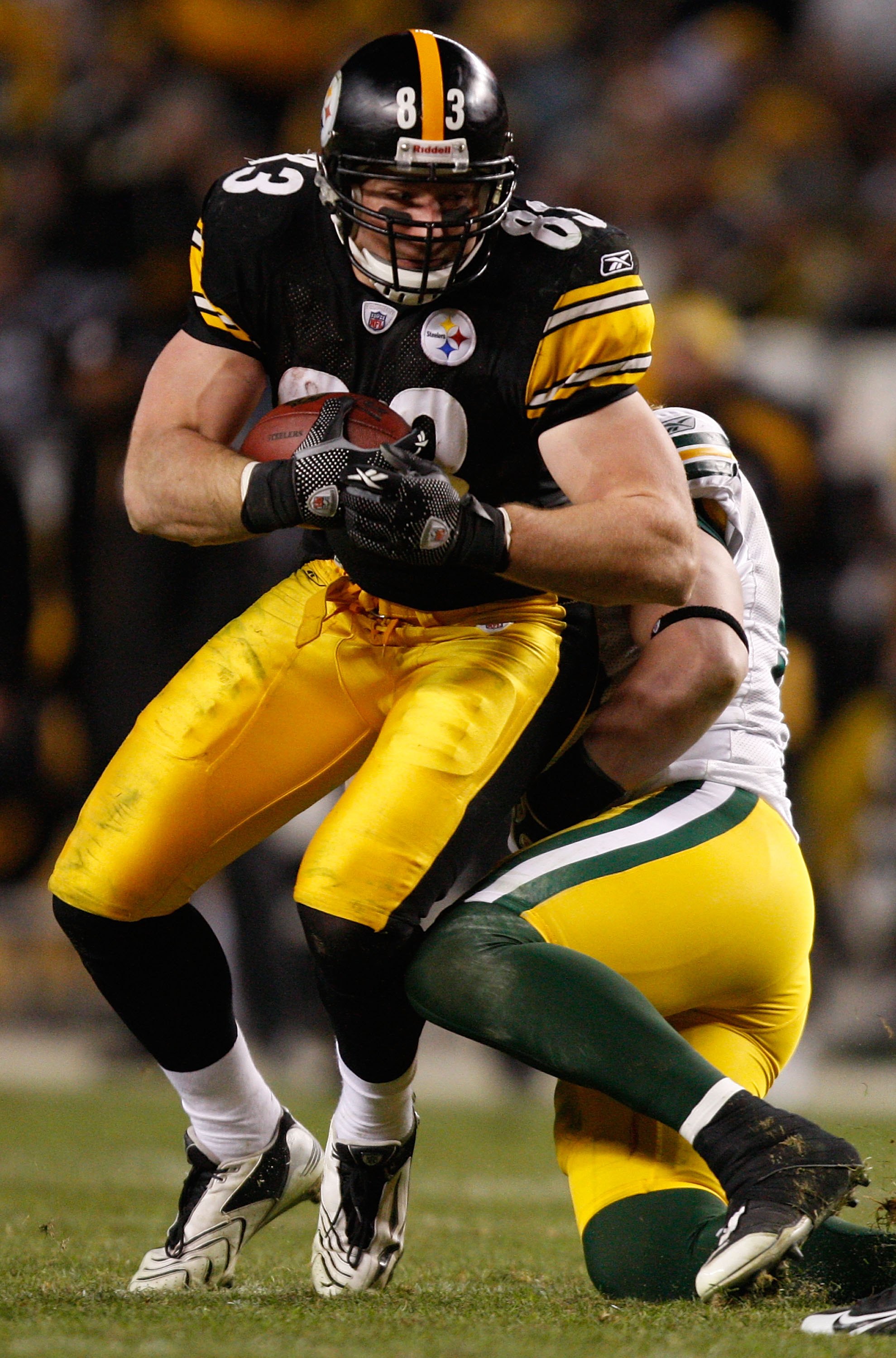 PITTSBURGH - DECEMBER 20: Heath Miller #83 of the Pittsburgh Steelers attempts to break through a tackle by AJ Hawk #50 of the Green Bay Packers during the game on December 20, 2009 at Heinz Field in Pittsburgh, Pennsylvania. (Photo by Jared Wickerham/Get
