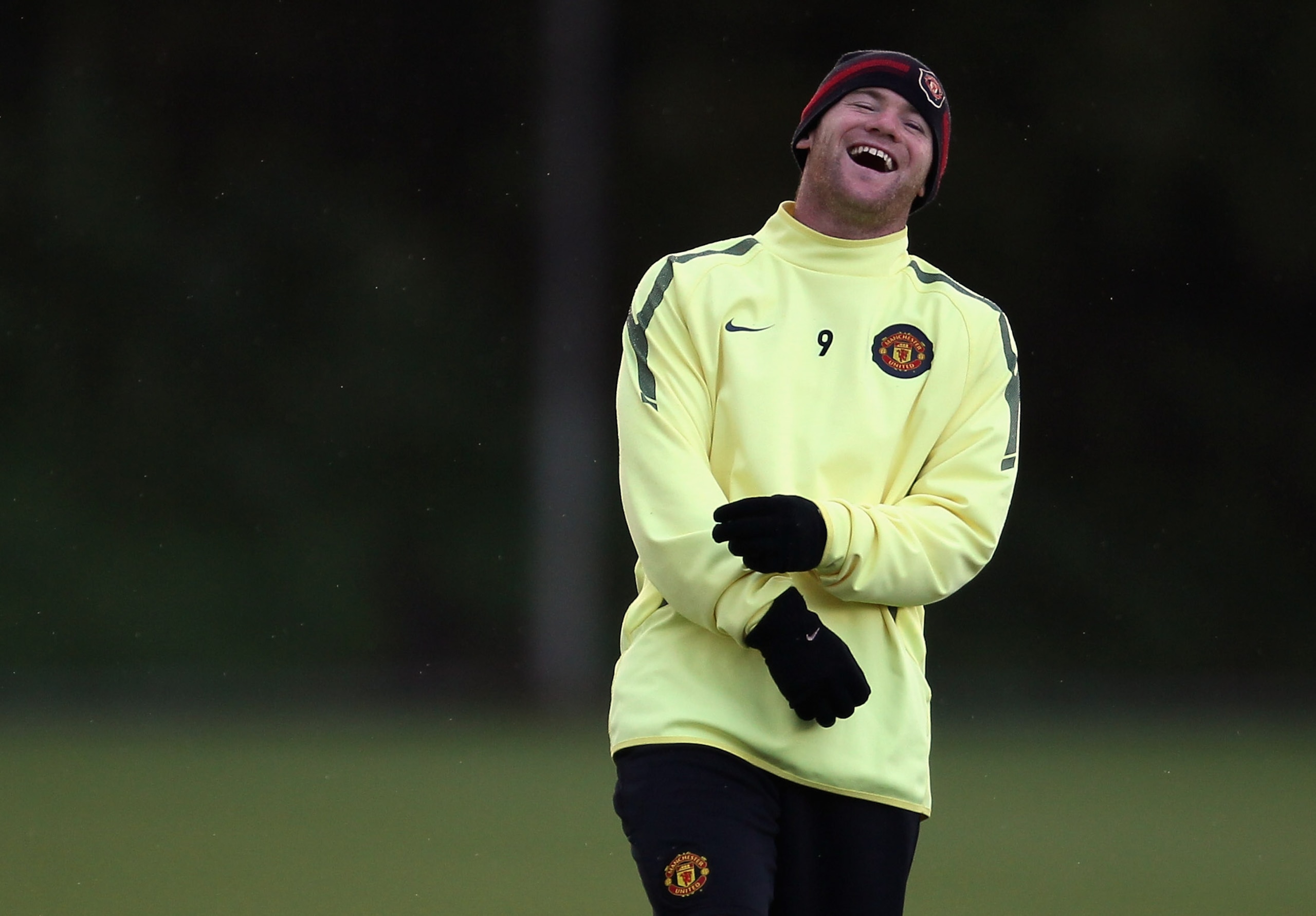 MANCHESTER, ENGLAND - OCTOBER 19:  Wayne Rooney of Manchester United enjoys a joke during a training session at the Carrington Training Complex on October 19, 2010 in Manchester, England.  (Photo by Alex Livesey/Getty Images)