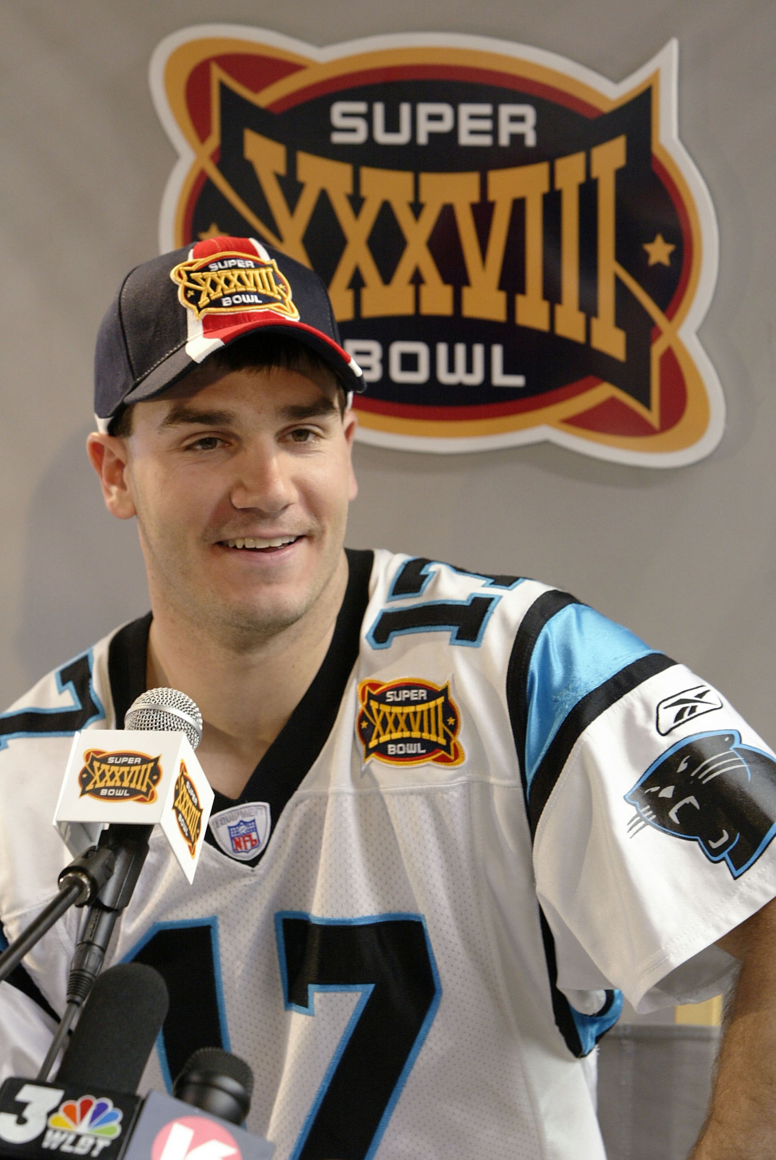 HOUSTON - JANUARY 27:  Quarterback Jake Delhomme #17 of the Carolina Panthers listens to a question on media day January 27, 2003 at the Reliant Stadium before Super Bowl XXXVIII against the New England Patriots in Houston, Texas.  (Photo by Brian Bahr/Ge