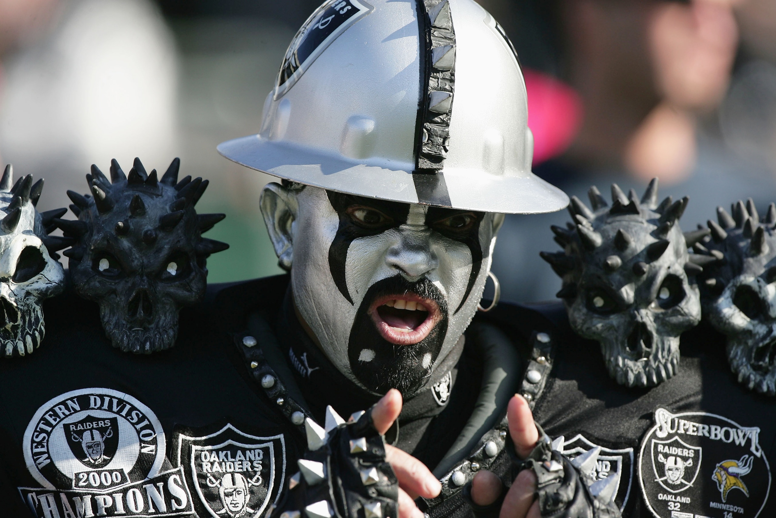 OAKLAND, CA - DECEMBER 19:  A fan of the Oakland Raiders cheers during the game against the Tennessee Titans at Network Associates Coliseum on December 19, 2004 in Oakland, California. (Photo by Jed Jacobsohn/Getty Images)
