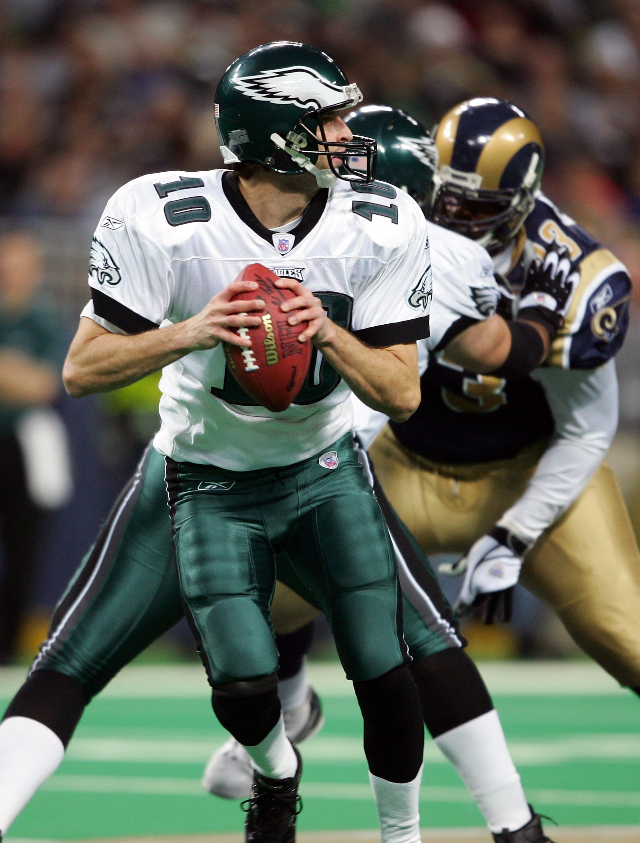 ST.LOUIS - DECEMBER 27:  Koy Detmer #10 of the Philadelphia Eagles drops back to pass  against the St. Louis Rams on December 27, 2004 at the Edward Jones Dome in St. Louis, Missouri.  (Photo by Elsa/Getty Images)