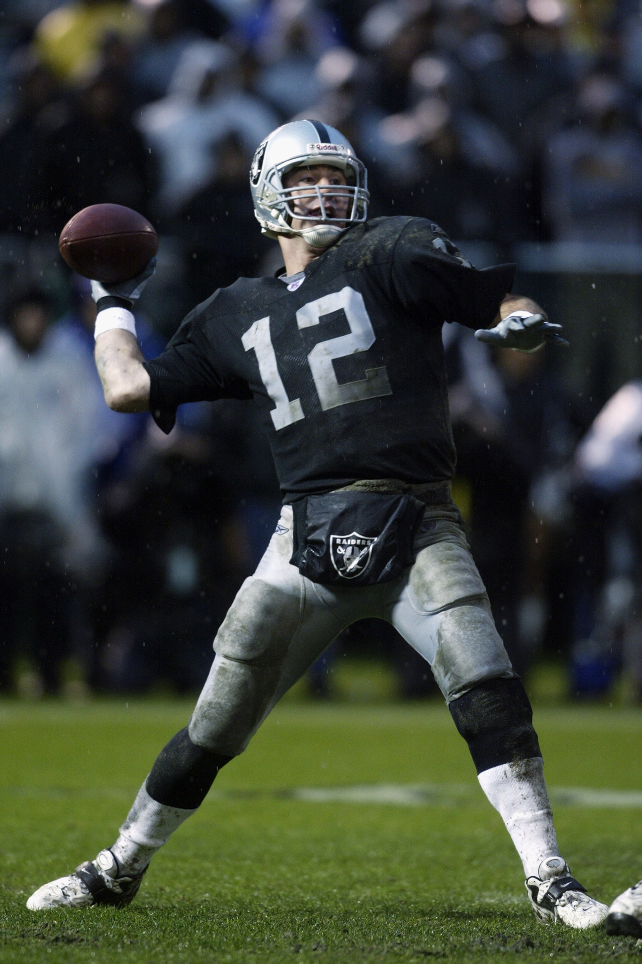 OAKLAND, CA - DECEMBER 28:  Rich Gannon #12 of the Oakland Raiders throws a pass against the Kansas City Chiefs during an NFL game at the Network Associates Coliseum on December 28, 2002 in Oakland, California.  The Raiders defeated the Chiefs 24-0. (Phot