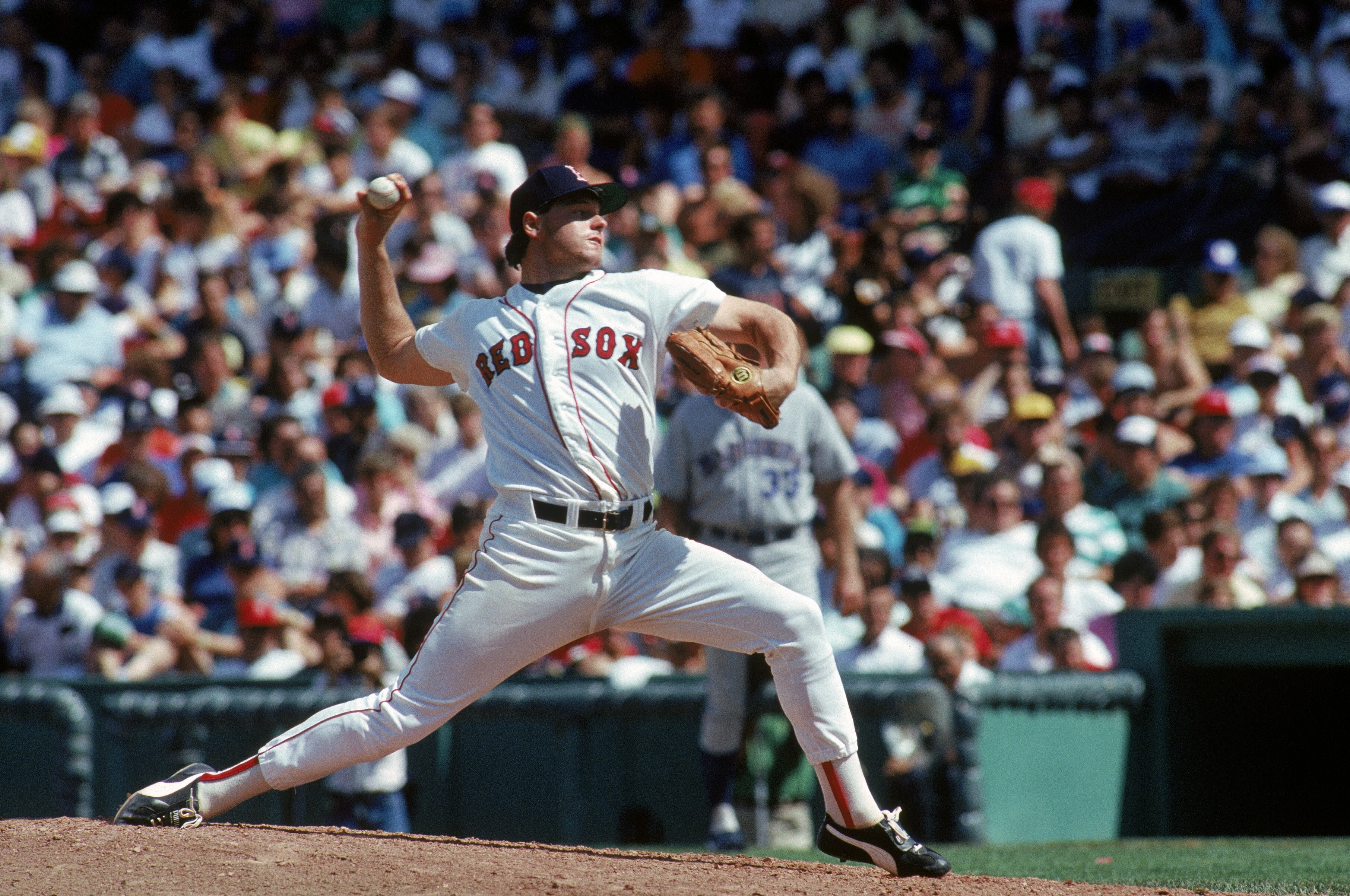 BOSTON, MA - 1987:  Roger Clemens #21 of the Boston Red Sox pitches against the Seattle Mariners during a game in the 1987 MLB Season at Fenway Park in Boston, Massachusetts. (Photo by Rick Stewart/Getty Images)