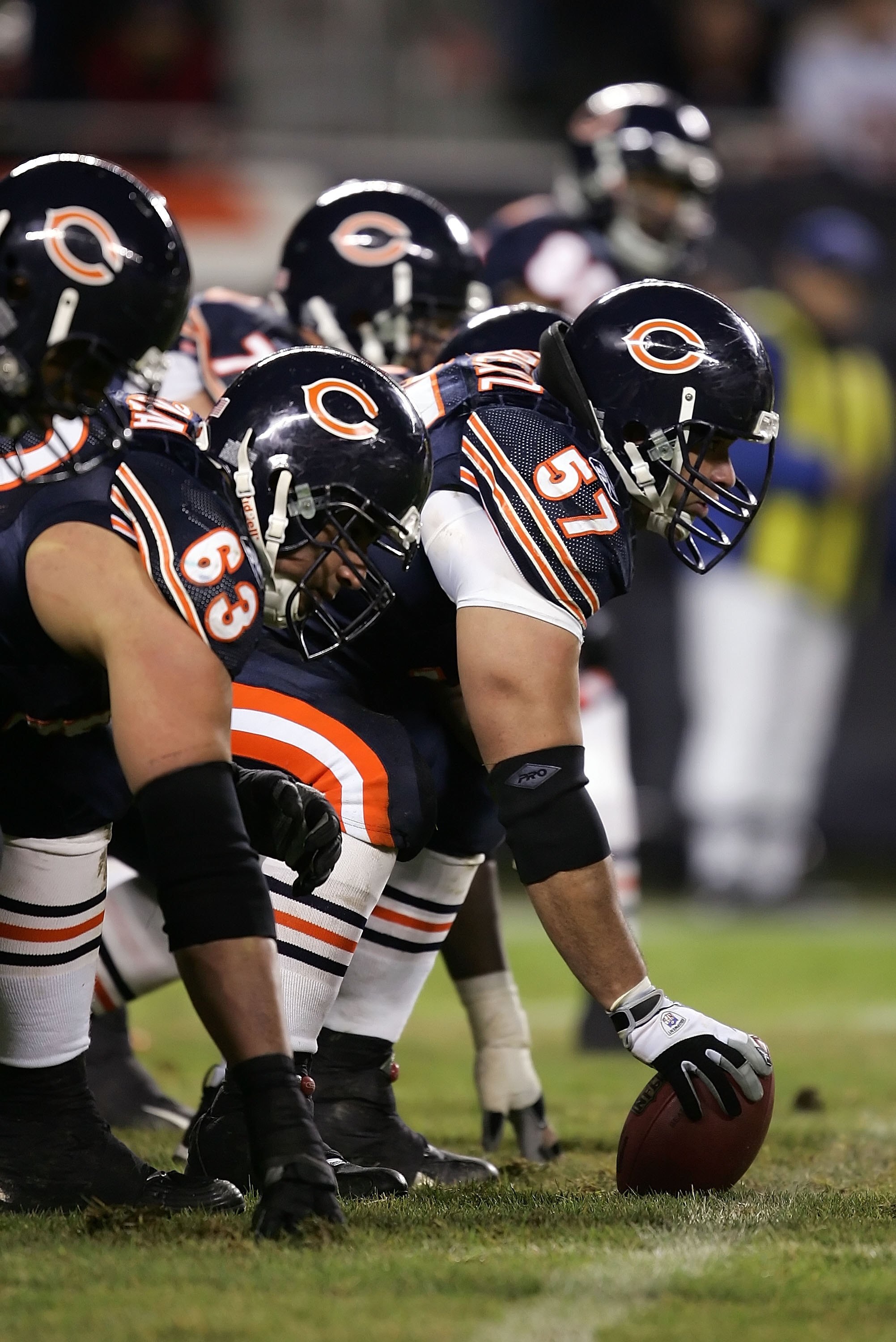 CHICAGO - DECEMBER 31:  Center Olin Kreutz #57 of the Chicago Bears readies to snap the ball against the Green Bay Packers December 31, 2006 at Soldier Field in Chicago, Illinois. The Packers won 26-7. (Photo by Jonathan Daniel/Getty Images)
