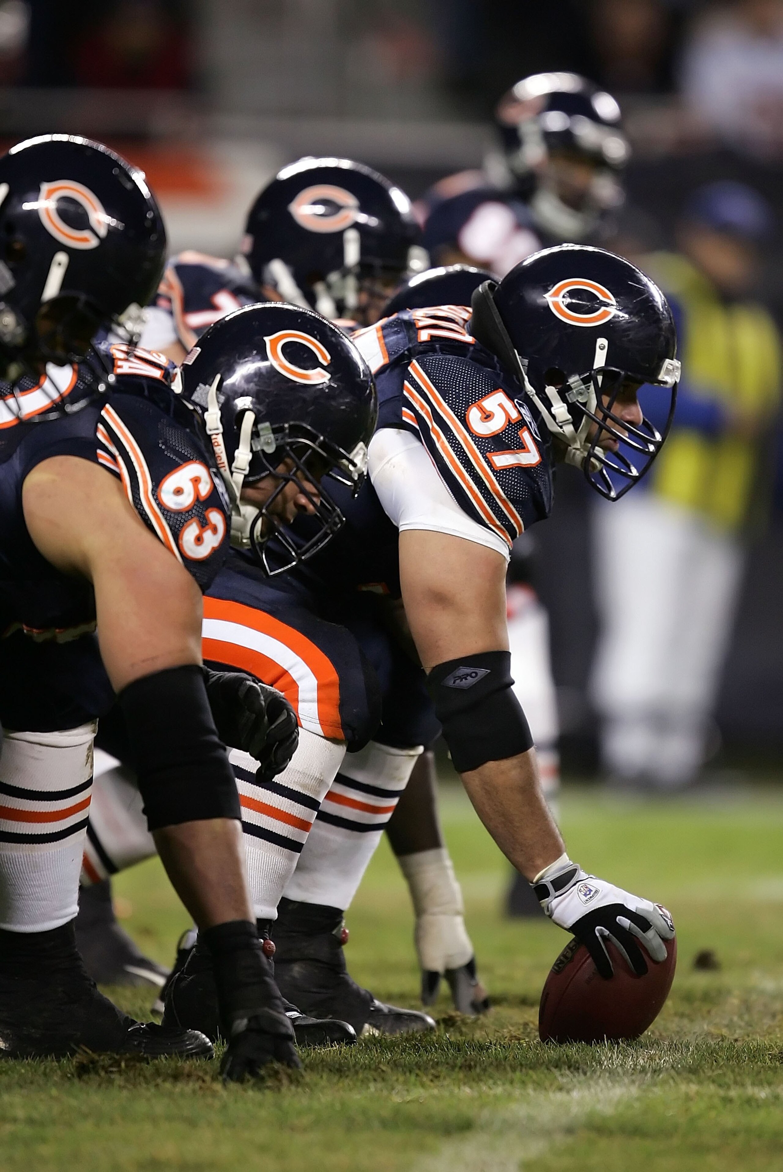 CHICAGO - DECEMBER 31:  Center Olin Kreutz #57 of the Chicago Bears readies to snap the ball against the Green Bay Packers December 31, 2006 at Soldier Field in Chicago, Illinois. The Packers won 26-7. (Photo by Jonathan Daniel/Getty Images)