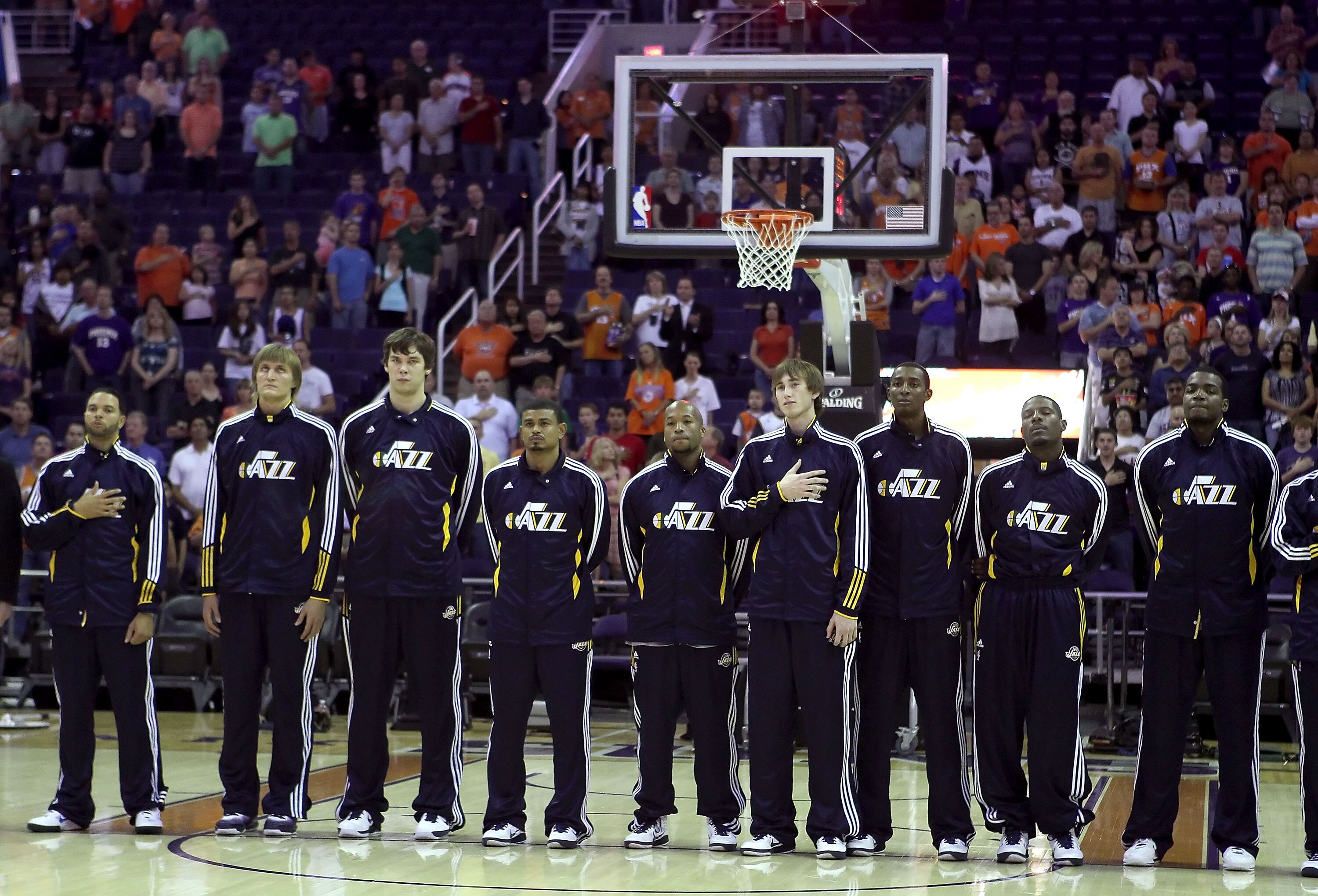 PHOENIX - OCTOBER 12:  The Utah Jazz stand attended for the National Anthem before the preseason NBA game against the Phoenix Suns at US Airways Center on October 12, 2010 in Phoenix, Arizona. NOTE TO USER: User expressly acknowledges and agrees that, by 