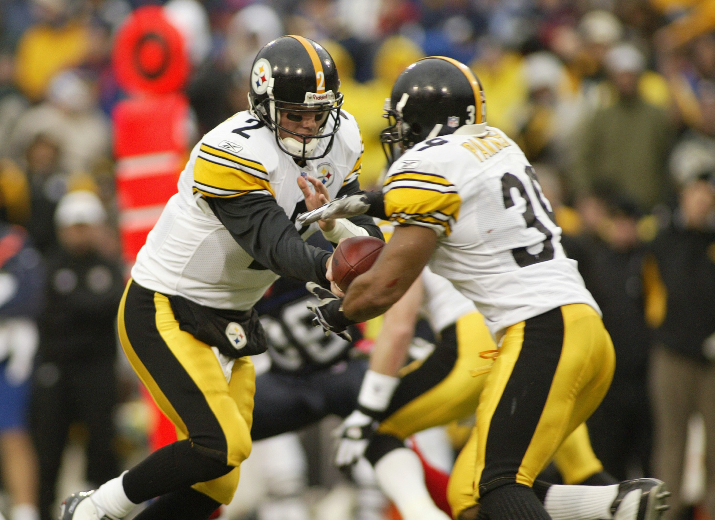 ORCHARD PARK, NY - JANUARY 2: Quarterback Brian St. Pierre #2 of the Pittsburgh Steelers hands off to Willie Parker #39 against the Buffalo Bills January 2, 2004 at Ralph Wilson Stadium in Orchard Park, New York. The Steelers defeated the Bills 29-24, to