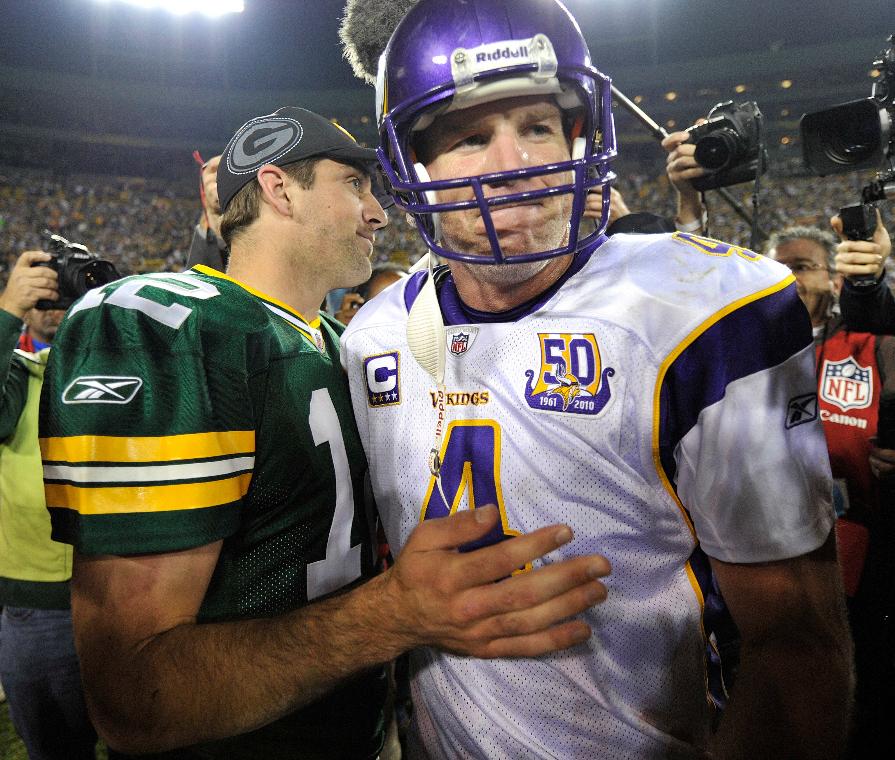 GREEN BAY, WI - OCTOBER 24: Aaron Rodgers #12 of the Green Bay Packers meets with Brett Favre #4 of the Minnesota Vikings after the Packers defeated the Vikings 28-24 at Lambeau Field on October 24, 2010 in Green Bay, Wisconsin. (Photo by Jim Prisching/Ge