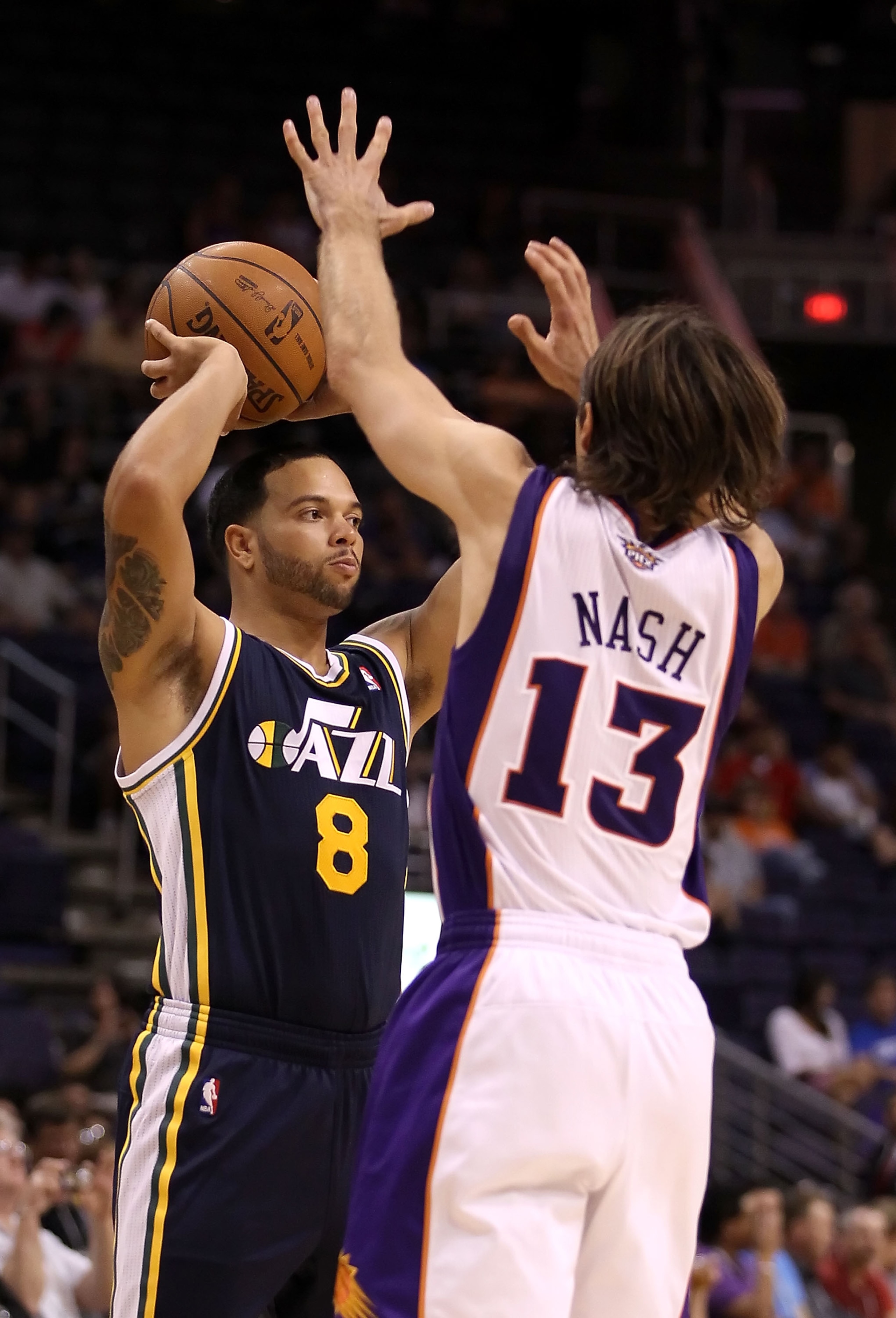 PHOENIX - OCTOBER 12:  Deron Williams #8 of the Utah Jazz looks to pass the ball around Steve Nash #13 of the Phoenix Suns during the preseason NBA game at US Airways Center on October 12, 2010 in Phoenix, Arizona. NOTE TO USER: User expressly acknowledge
