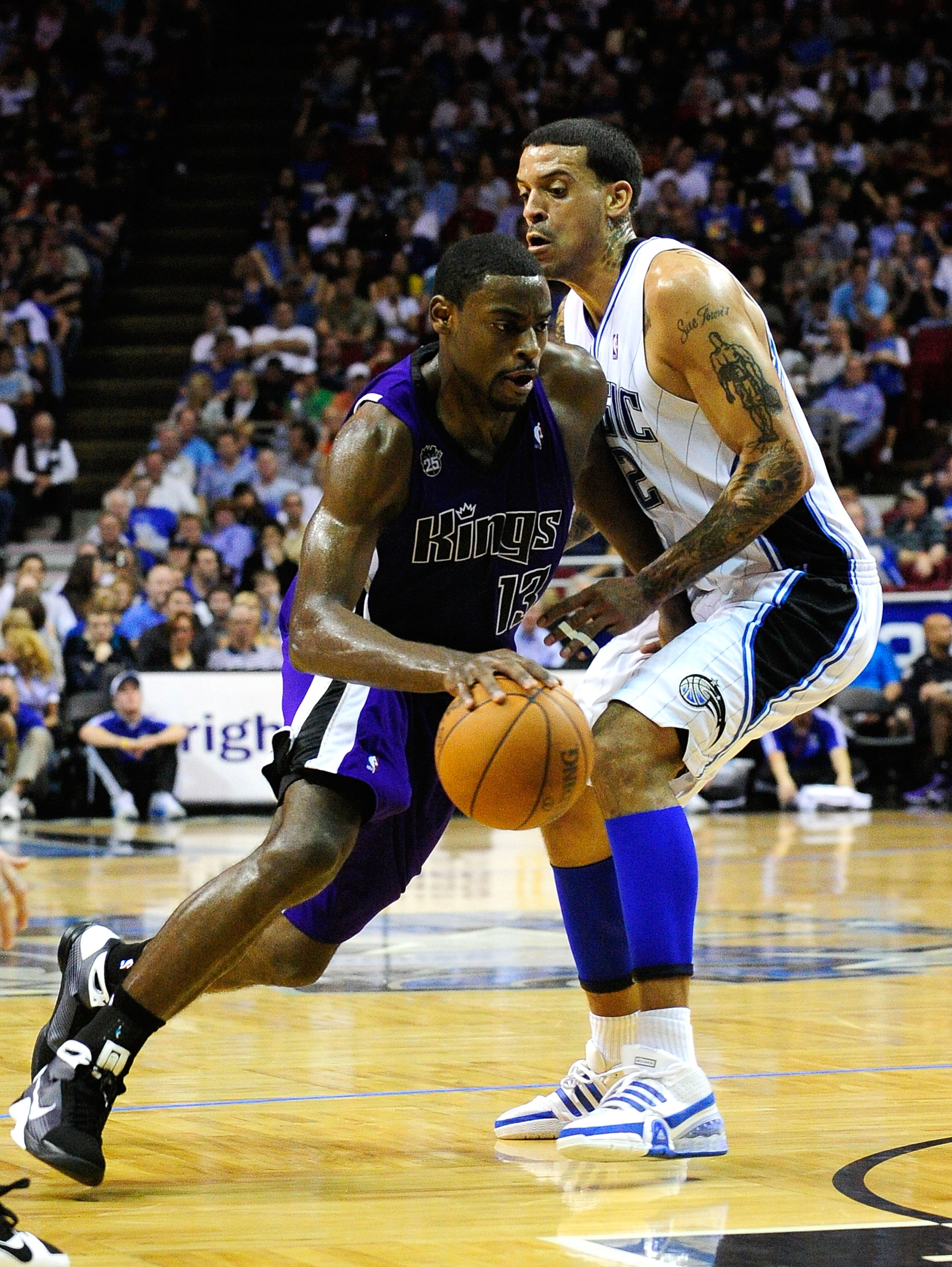 ORLANDO, FL - JANUARY 22:  Tyreke Evans #13 of the Sacramento Kings drives against Matt Barnes #22 of the Orlando Magic during the game at Amway Arena on January 22, 2010 in Orlando, Florida. NOTE TO USER: User expressly acknowledges and agrees that, by d