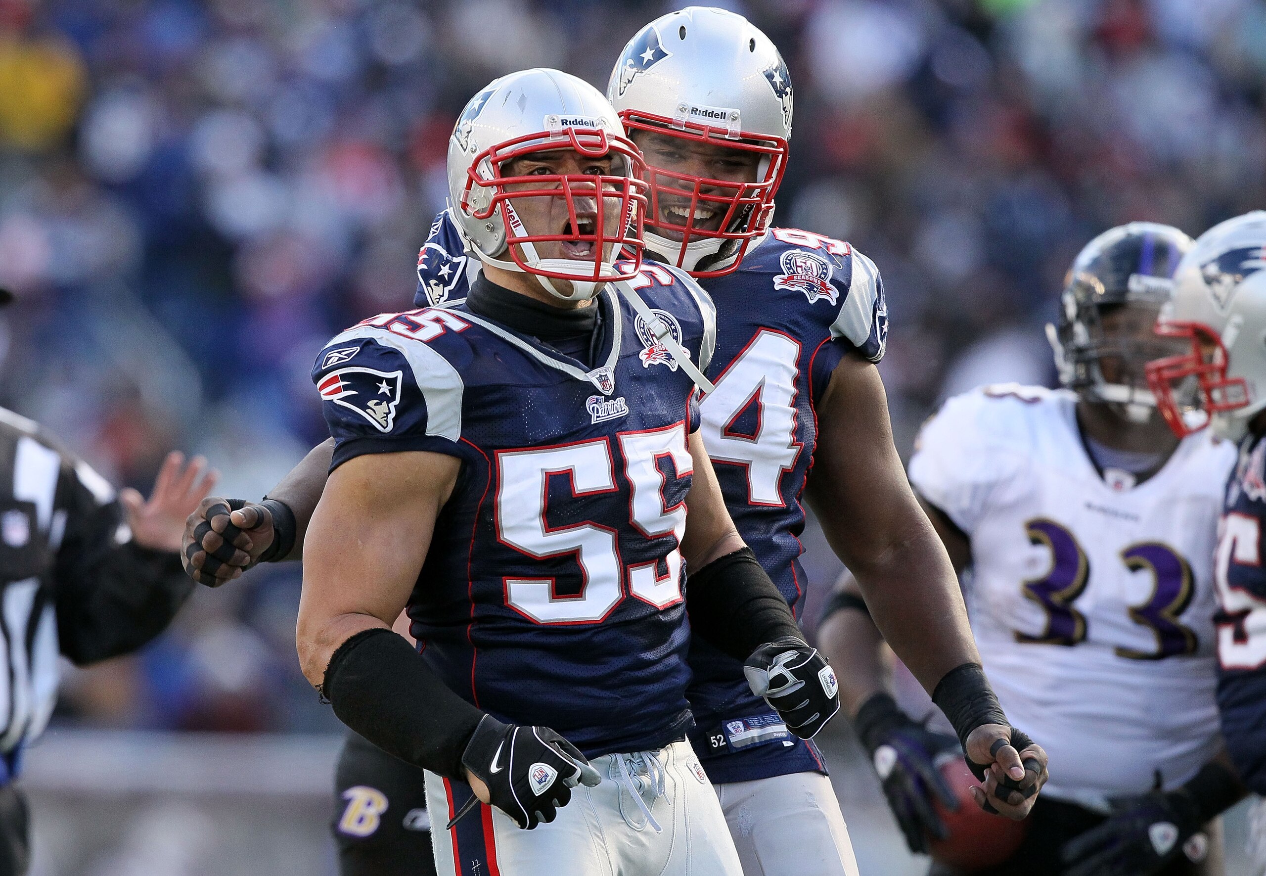 FOXBORO, MA - JANUARY 10:  Junior Seau #55 and Ty Warren #94 of the New England Patriots celebrate a defensive stop in the first half against the Baltimore Ravens during the 2010 AFC wild-card playoff game at Gillette Stadium on January 10, 2010 in Foxbor
