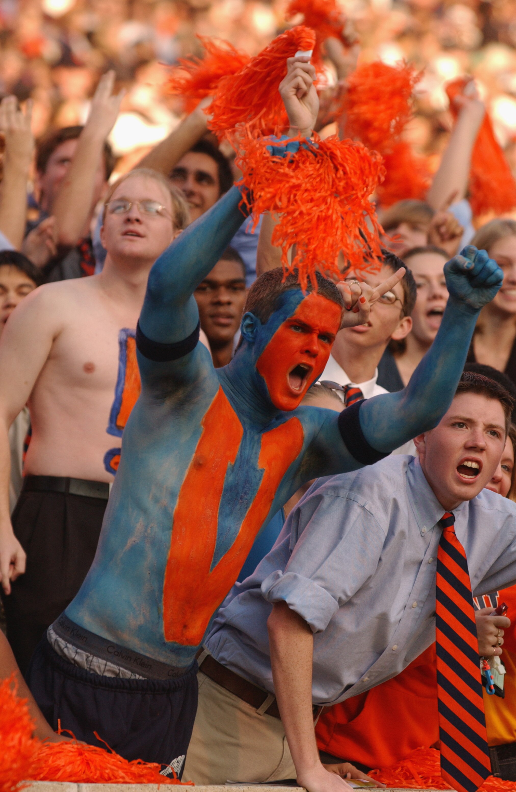 CHARLOTTSVILLE, VA - NOVEMBER 17:  A painted fan of the University of Virginia Cavaliers cheers maniacally during the NCAA football game against the Virginia Tech Hokies on November 17, 2001 at Scott Stadium in Charlottesville, Virginia.  Virginia Tech wo