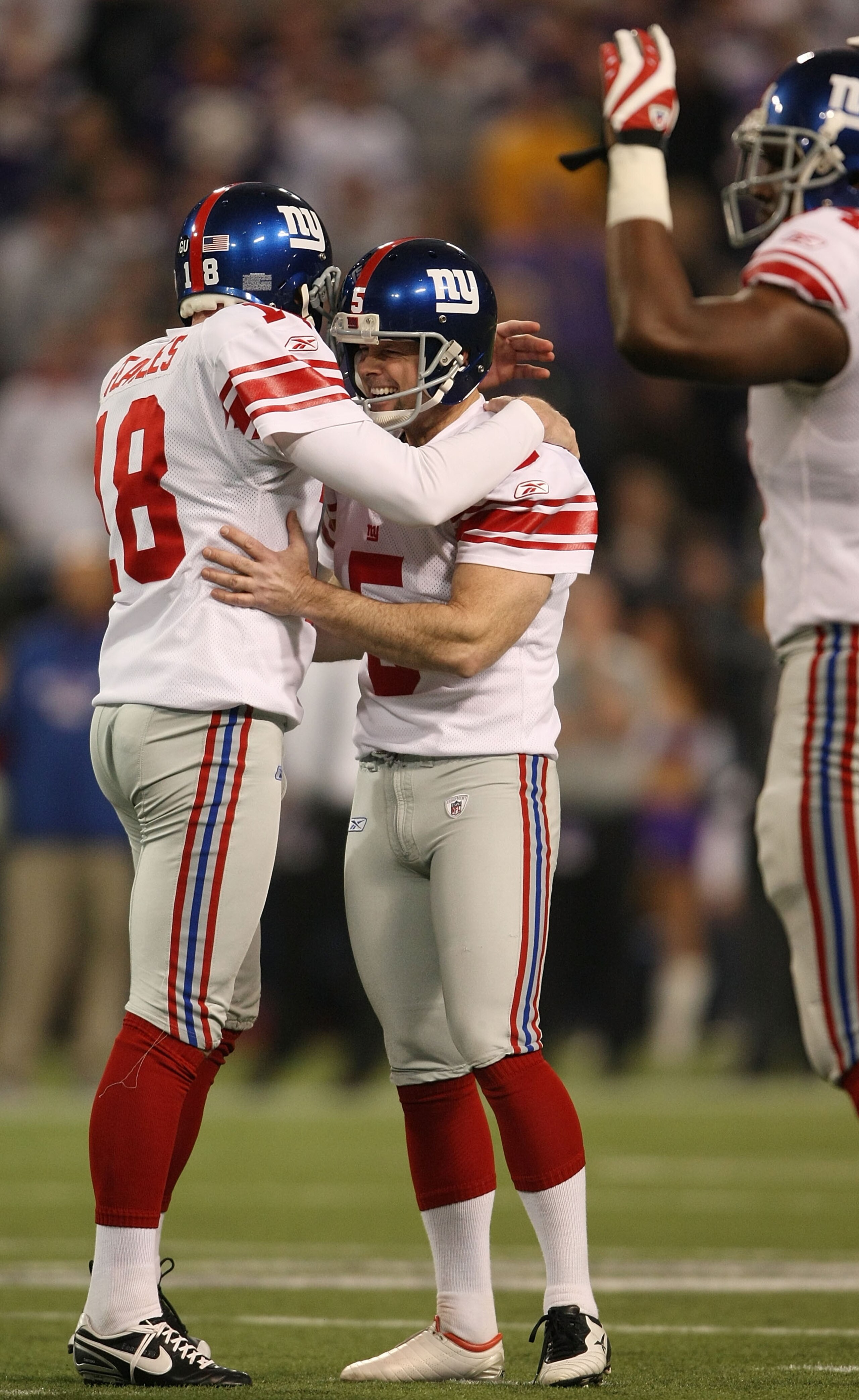 MINNEAPOLIS - DECEMBER 28:   John Carney #5 and Jeff Feagles #18 of the New York Giants celebrate the field goal in the second quarter against the Minnesota Vikings on December 28, 2008 at the Hubert H. Humphrey Metrodome in Minneapolis, Minnesota. (Photo