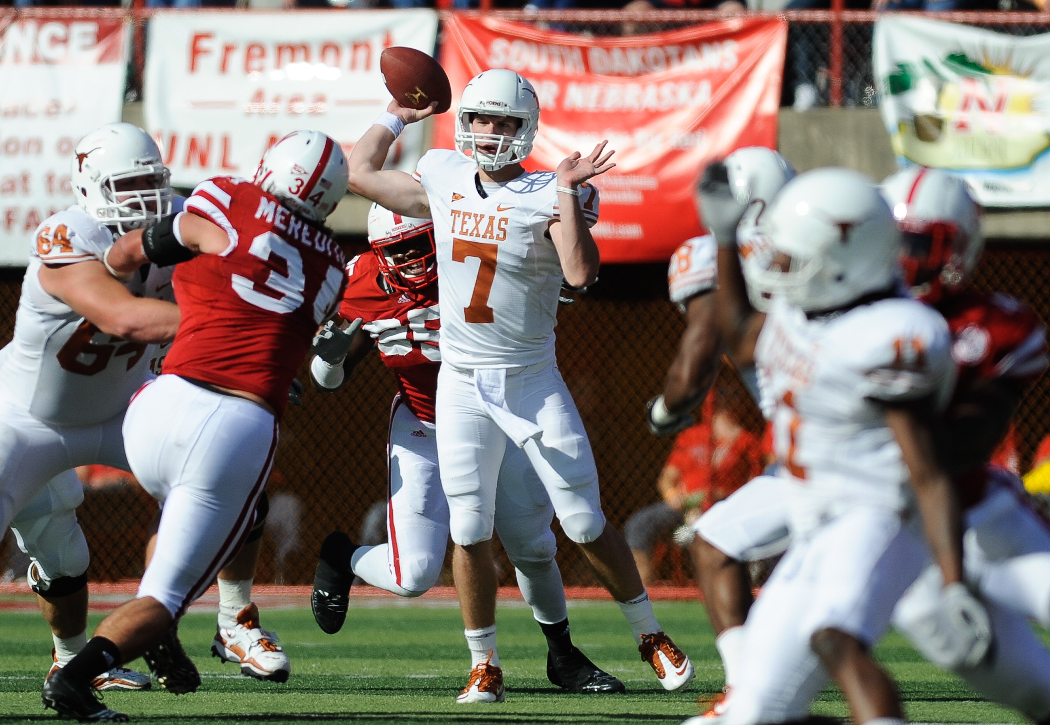 LINCOLN, NE - OCTOBER 16:  Quarterback Garrett Gilbert #7 of the Texas Longhorns passes the ball downfield during first half action of their game at Memorial Stadium on October 16, 2010 in Lincoln, Nebraska. Texas Defeated Nebraska 20-13. (Photo by Eric F