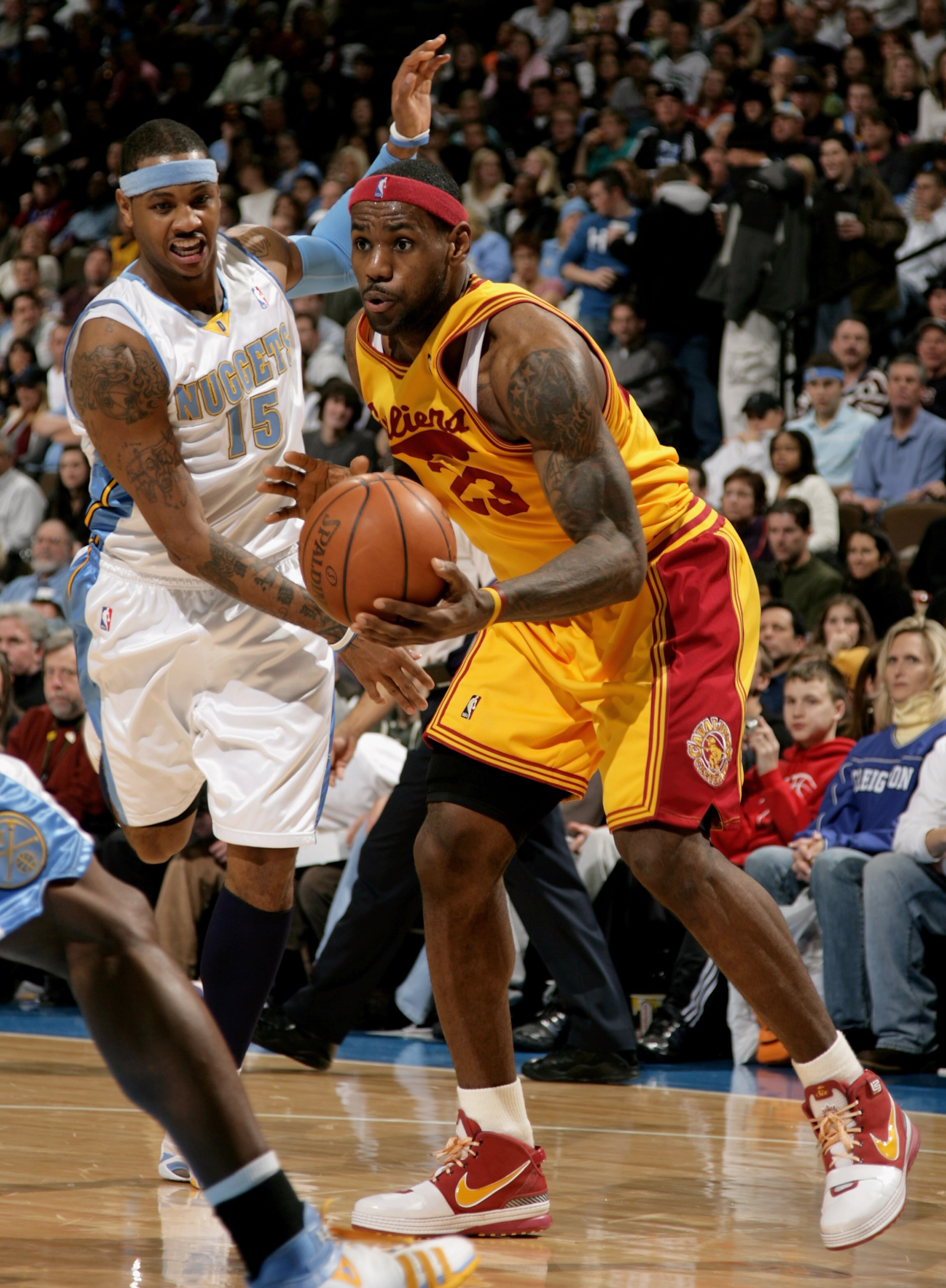 DENVER - DECEMBER 19:  LeBron James #23 of the Cleveland Cavaliers collects a pass in front of Carmelo Anthony #15 of the Denver Nuggets at the Pepsi Center on December 19, 2008 in Denver, Colorado. James had a game high 33 points as the Cavs defeated the
