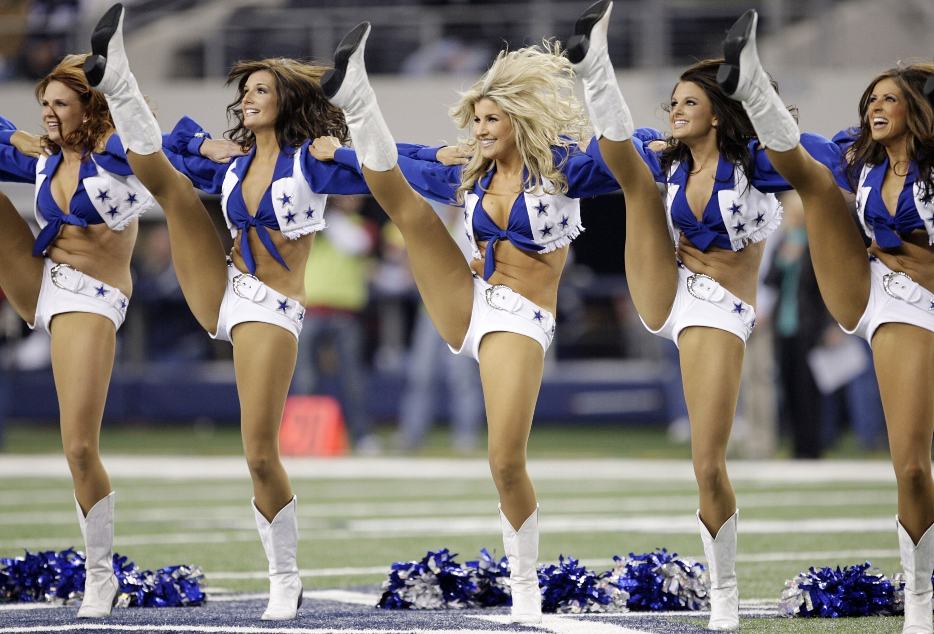 ARLINGTON, TX - JANUARY 9:  Dallas Cowboys cheerleaders perform in the first half as the Cowboys take on the Philadelphia Eagles during the 2010 NFC wild-card playoff game at Cowboys Stadium on January 9, 2010 in Arlington, Texas. (Photo by Jamie Squire/G