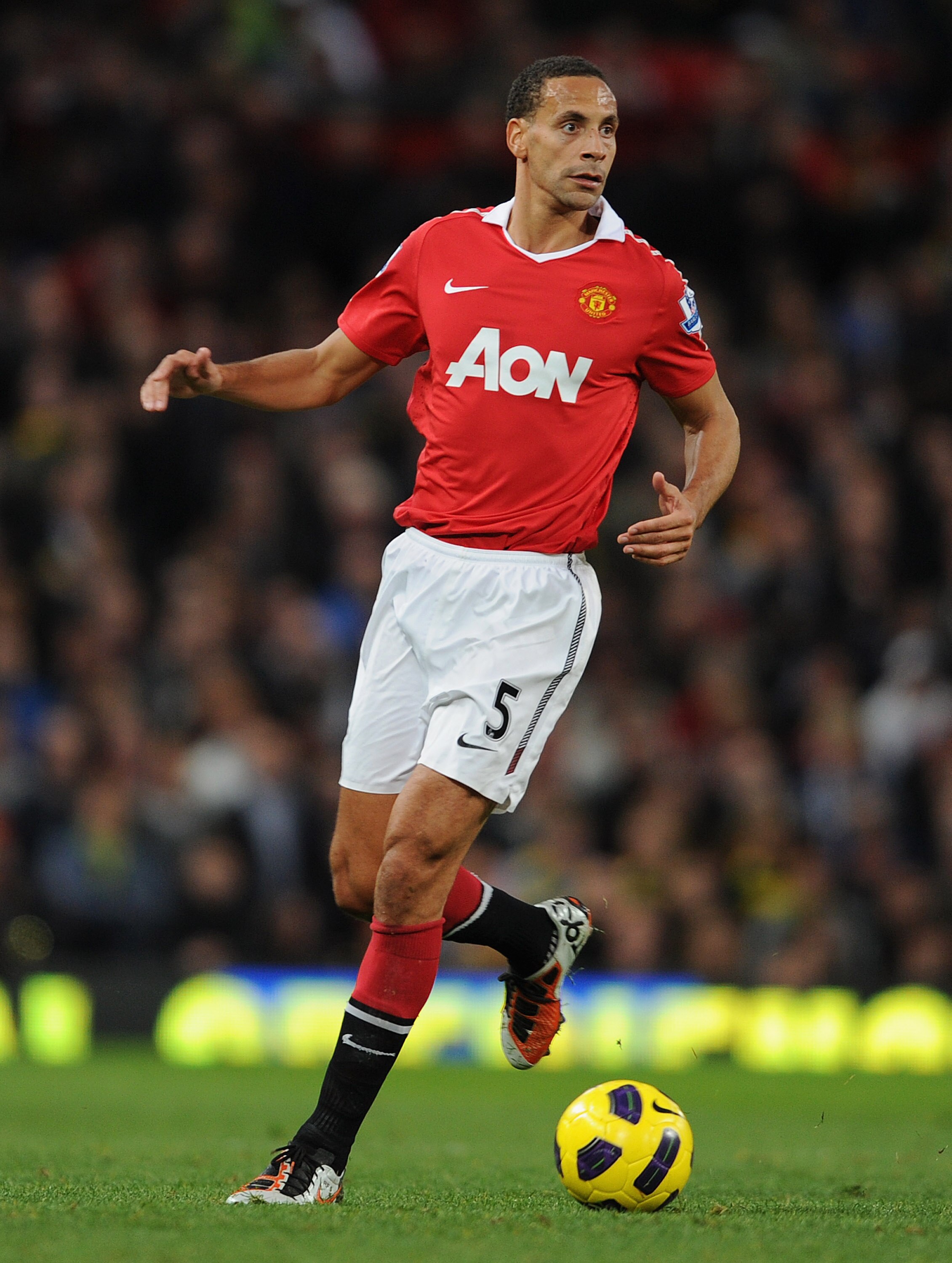 MANCHESTER, ENGLAND - OCTOBER 30: Rio Ferdinand of Manchester United on the ball during the Barclays Premier League match between Manchester United and Tottenham Hotspur at Old Trafford on October 30, 2010 in Manchester, England. (Photo by Michael Regan MANCHESTER, ENGLAND - OCTOBER 30: Rio Ferdinand of Manchester United on the ball during the Barclays Premier League match between Manchester United and Tottenham Hotspur at Old Trafford on October 30, 2010 in Manchester, England. (Photo by Michael Regan