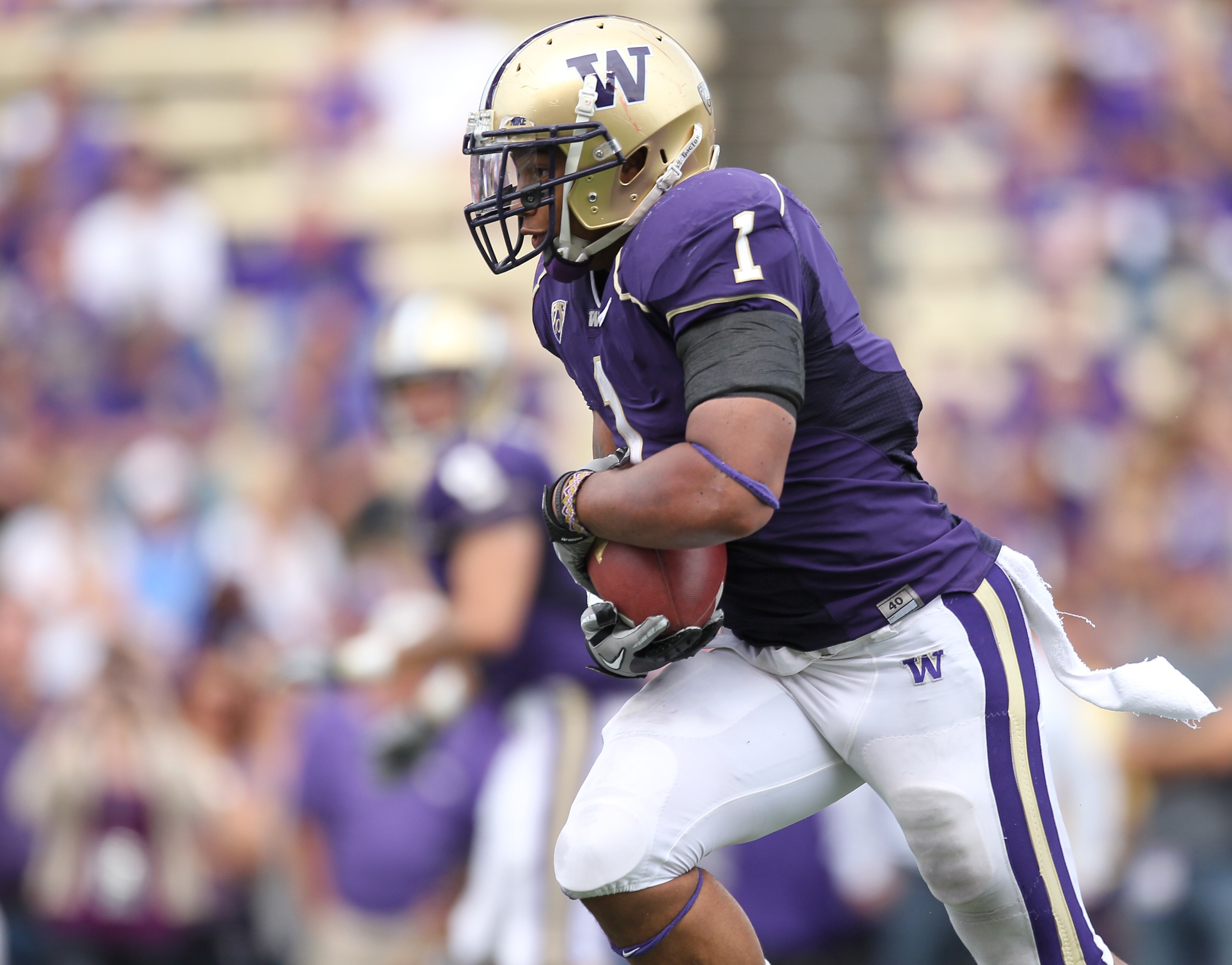 SEATTLE - SEPTEMBER 18: Running back Chris Polk #1 of the Washington Huskies rushes against the Nebraska Cornhuskers on September 18, 2010 at Husky Stadium in Seattle, Washington. (Photo by Otto Greule Jr/Getty Images)