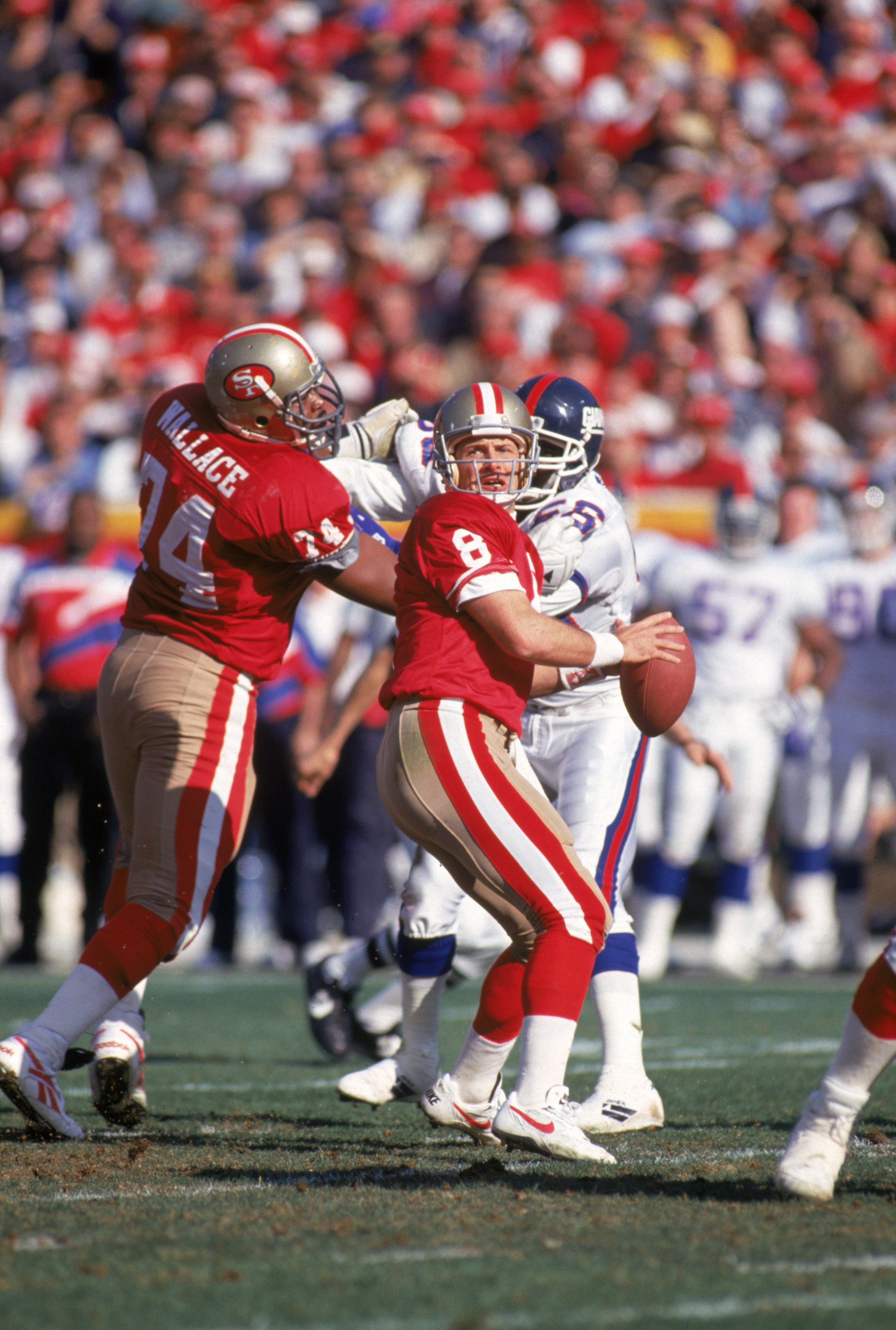SAN FRANCISCO - JANUARY 15:  Quarterback Steve Young #8 of the San Francisco 49ers drops back to pass during the 1993 NFC Divisional Playoff game against the New York Giants at Candlestick Park on January 15, 1994 in San Francisco, California.  The 49ers