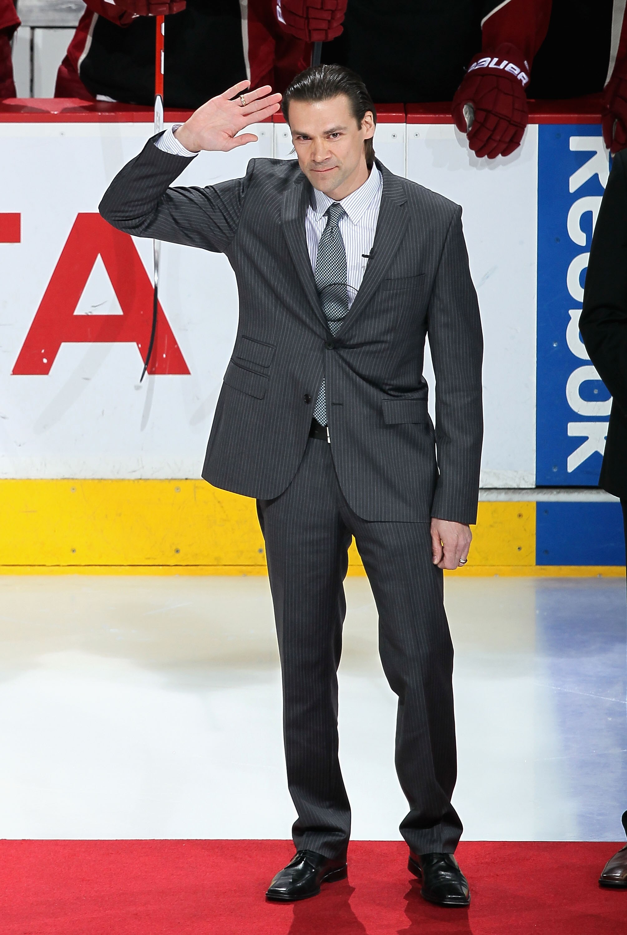 GLENDALE, AZ - JANUARY 30:  Teppo Numminen waves to fans as he is inducted into the Phoenix Coyotes 'Ring of Honor' before the NHL game against the New York Rangers at Jobing.com Arena on January 30, 2010 in Glendale, Arizona.  (Photo by Christian Peterse