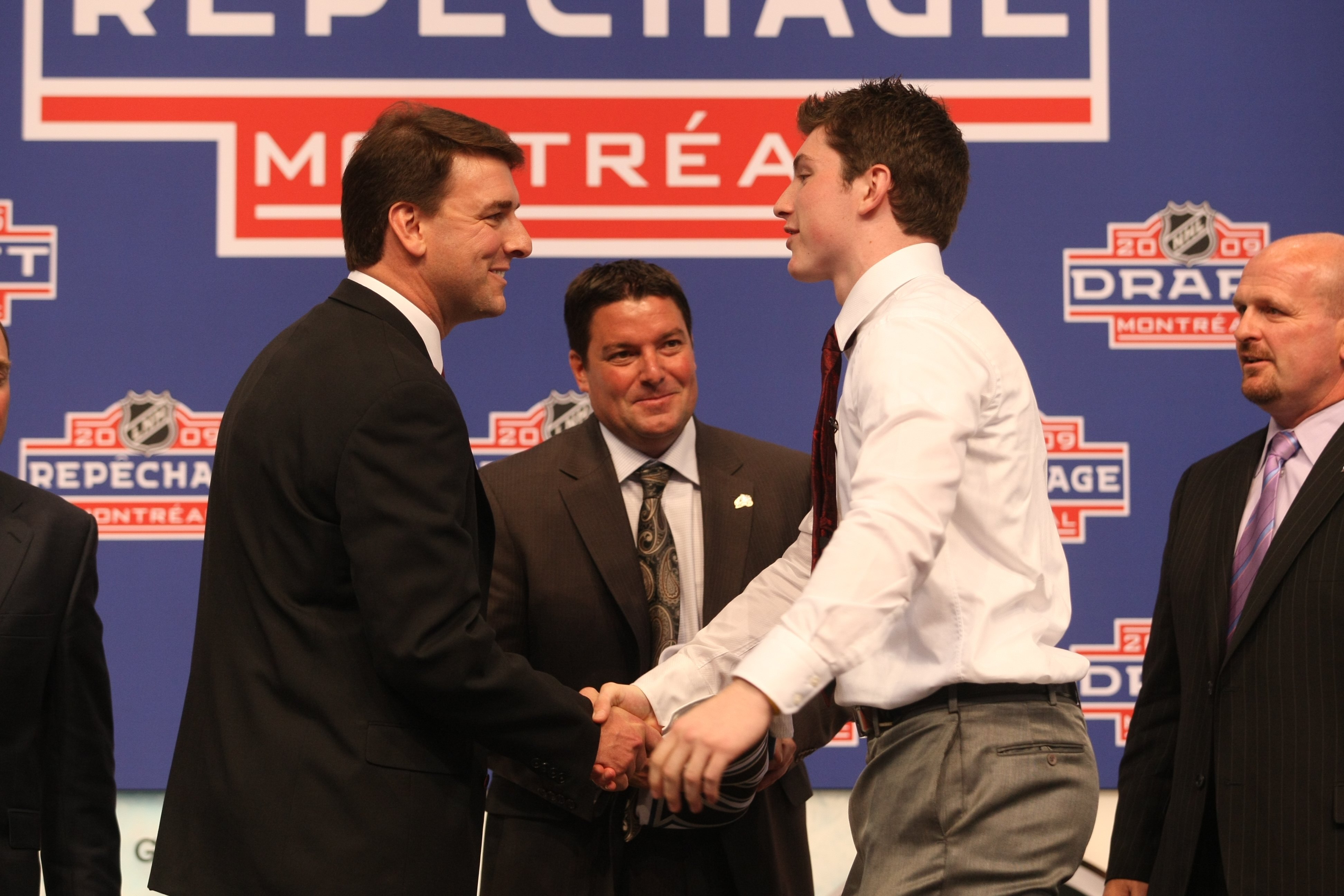 MONTREAL - JUNE 26:  Matt Duchene (r) shakes hands with Colorado Avalanche General Manager Greg Sherman after being drafted during the first round of the 2009 NHL Entry Draft at the Bell Centre on June 26, 2009 in Montreal, Quebec, Canada. (Photo by Bruce