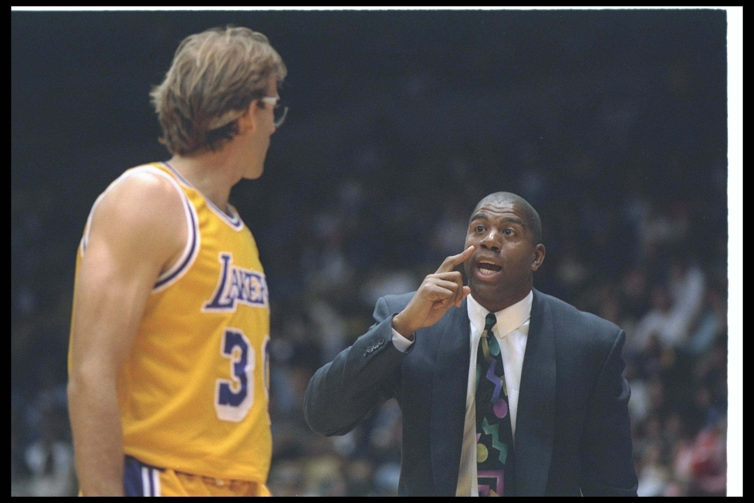 29 Mar 1994:  Los Angeles Lakers head coach Magic Johnson confers with Kurt Rambis during a game against the Minnesota Timberwolves at the Great Western Forum in Inglewood, California. Mandatory Credit: Stephen Dunn  /Allsport Mandatory Credit: Stephen Du