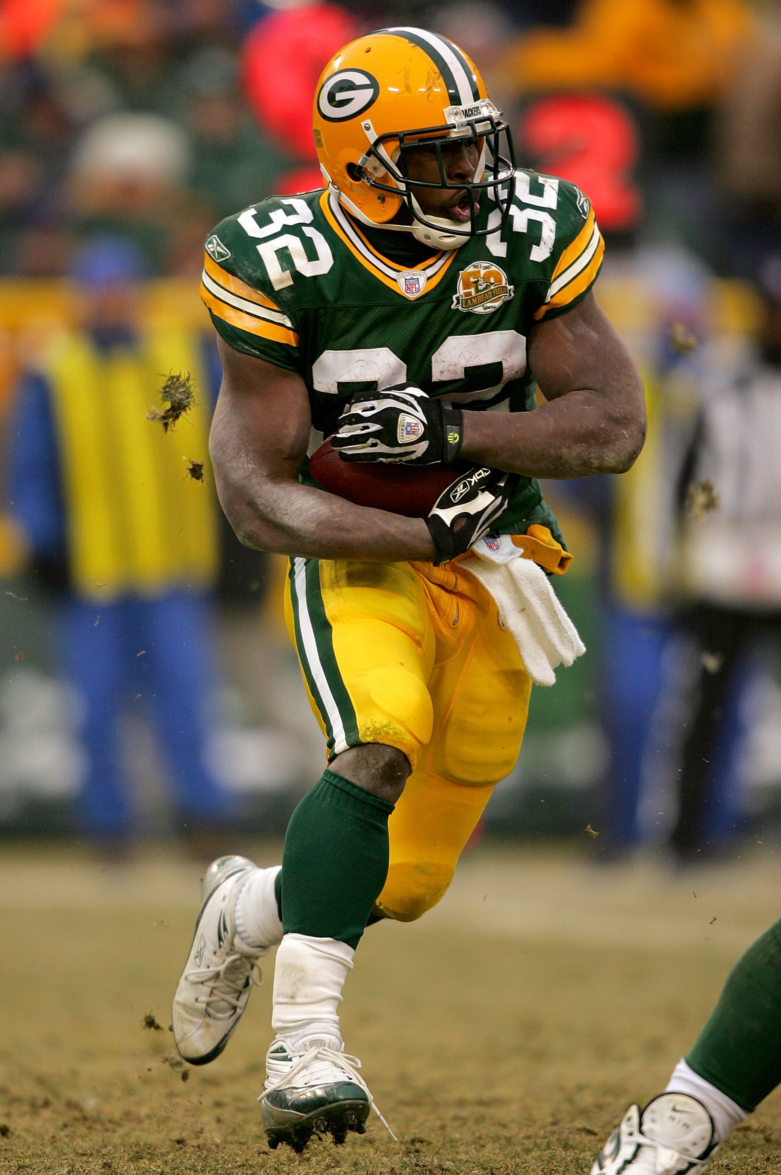 GREEN BAY, WI - DECEMBER 30:  Brandon Jackson #32 of the Green Bay Packers carries the ball against the Detroit Lions at Lambeau Field December 30, 2007 in Green Bay, Wisconsin.  (Photo by Matthew Stockman/Getty Images)