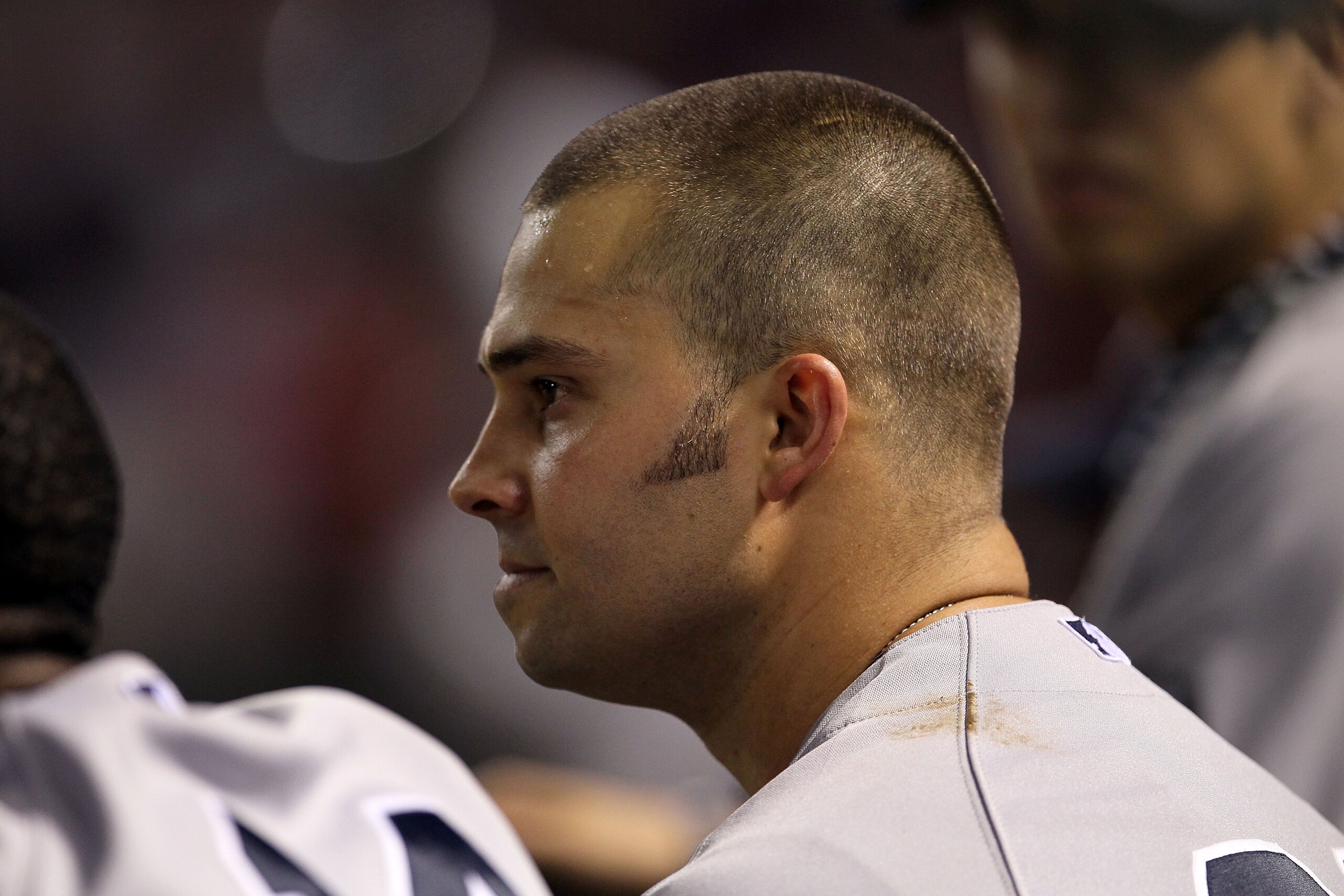ARLINGTON, TX - OCTOBER 22:  Nick Swisher #33 of the New York Yankees looks on from the dugout late in the game against the Texas Rangers in Game Six of the ALCS during the 2010 MLB Playoffs at Rangers Ballpark in Arlington on October 22, 2010 in Arlingto