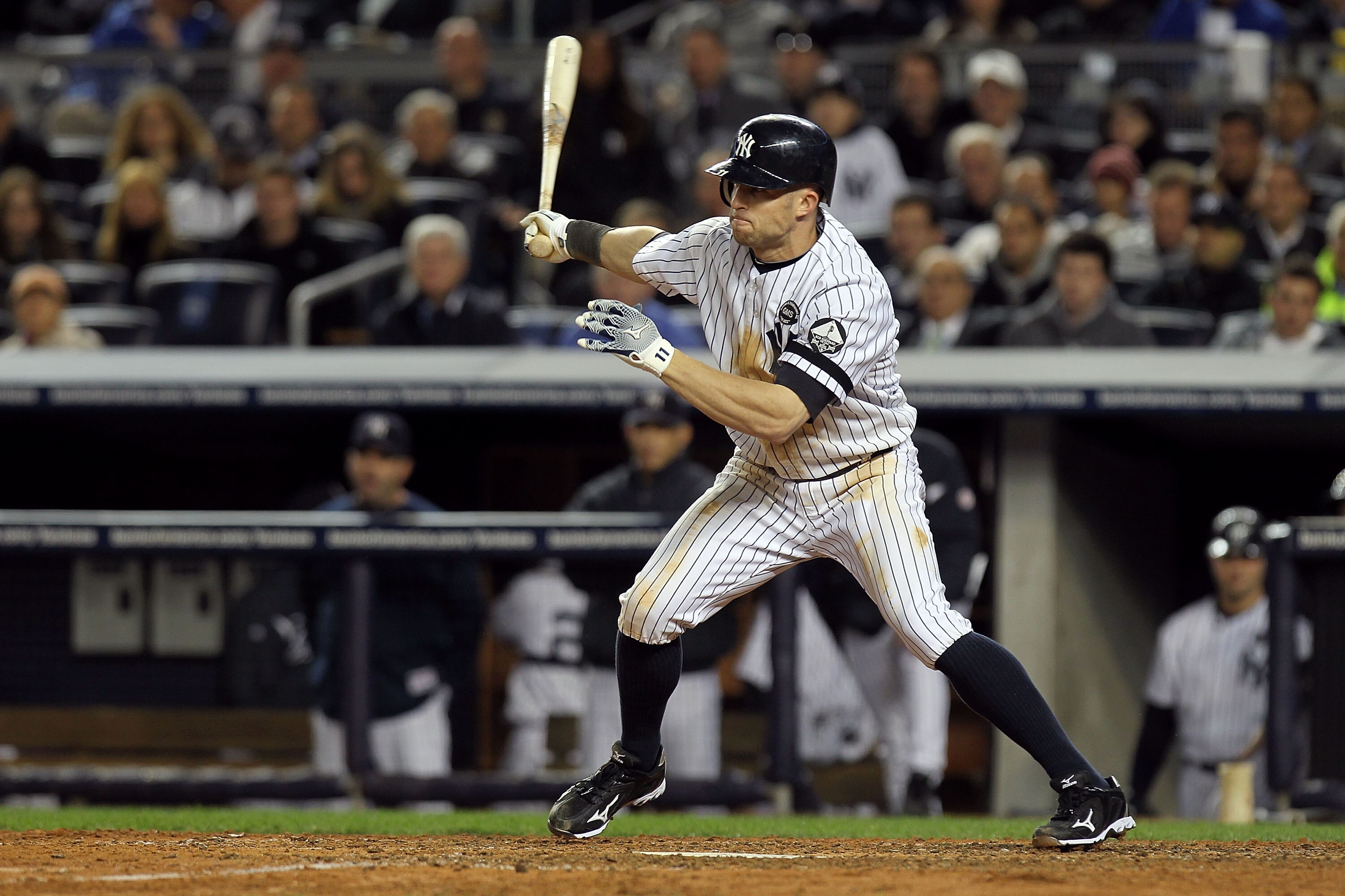 NEW YORK - OCTOBER 18:  Brett Gardner #11 of the New York Yankees hits a single in the bottom of the sixth inning against the Texas Rangers in Game Three of the ALCS during the 2010 MLB Playoffs at Yankee Stadium on October 18, 2010 in New York, New York.