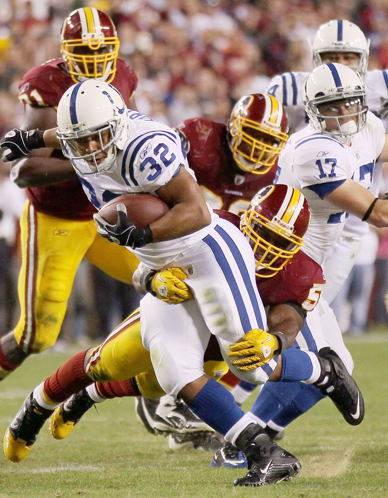 LANDOVER, MD - OCTOBER 17:  Running back Mike Hart #32 of the Indianapolis Colts is tackled by London Fletcher #59 of the Washington Redskins at FedEx Field on October 17, 2010 in Landover, Maryland. The Colts won the game 27-24.  (Photo by Win McNamee/Ge