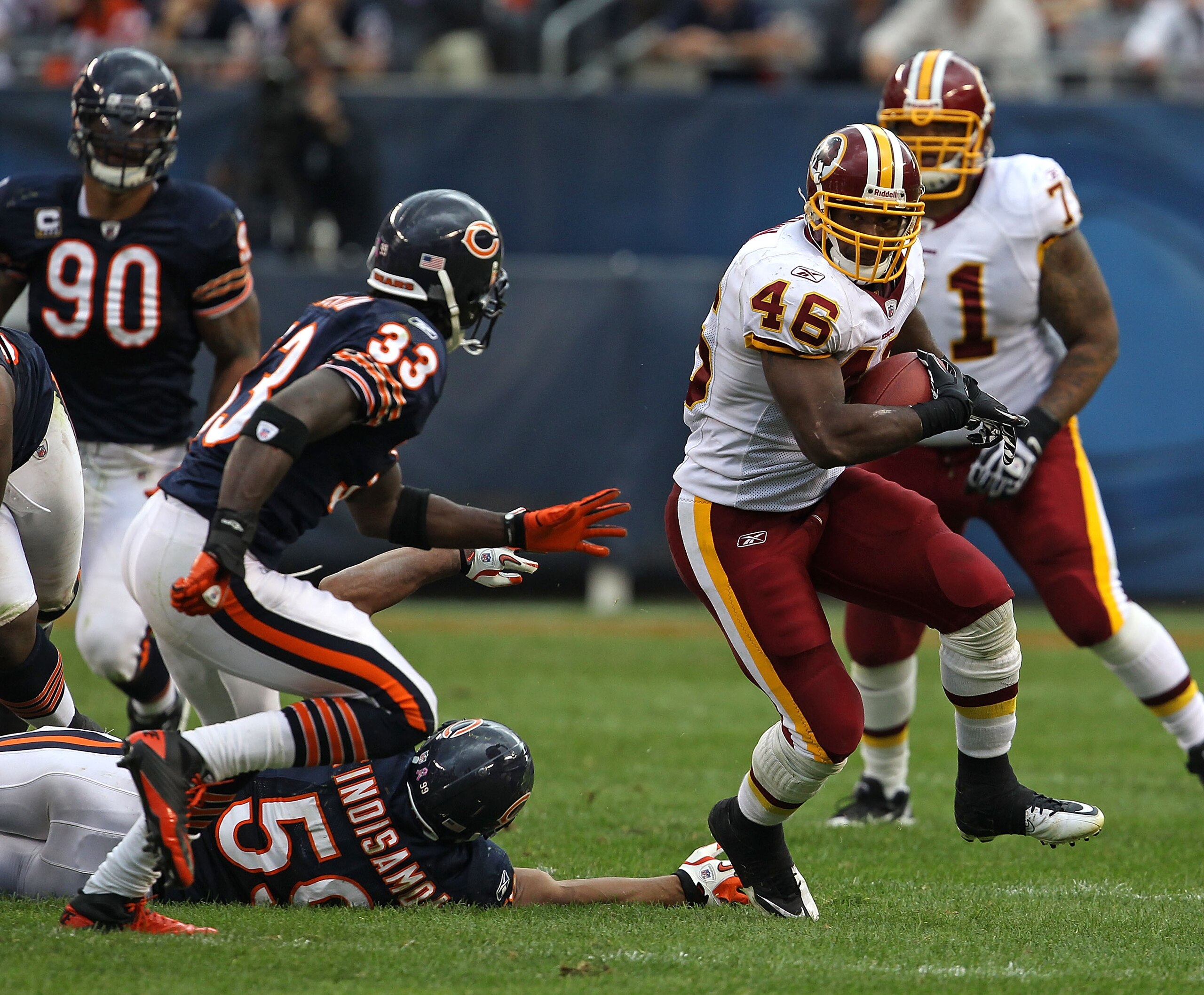 CHICAGO - OCTOBER 24: Ryan Torain #46 of the Washington Redskins runs past Pisa Tinoisamoa #59 of the Chicago Bears as Charles Tillman #33 closes in at Soldier Field on October 24, 2010 in Chicago, Illinois. The Redskins defeated the Bears 17-14. (Photo b CHICAGO - OCTOBER 24: Ryan Torain #46 of the Washington Redskins runs past Pisa Tinoisamoa #59 of the Chicago Bears as Charles Tillman #33 closes in at Soldier Field on October 24, 2010 in Chicago, Illinois. The Redskins defeated the Bears 17-14. (Photo b